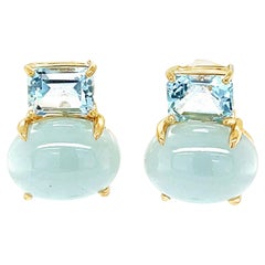 Orecchini con acquamarina taglio cabochon e taglio smeraldo in 18 carati con fermagli francesi