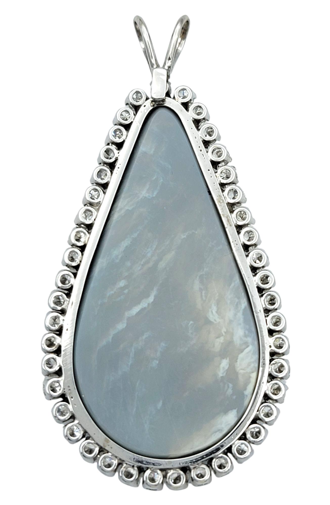 Pear Cut Cabochon Cut Black Opal & Diamond Halo Teardrop Pendant in 14 Karat White Gold For Sale