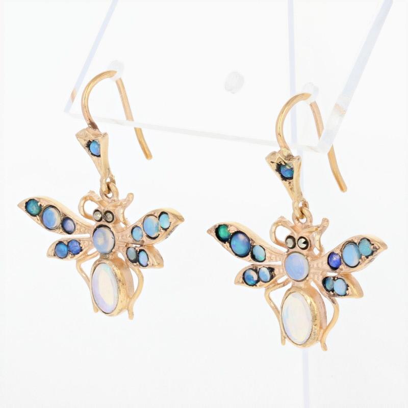 These enchanting earrings would make a wonderful gift for someone who treasures jewelry from yesteryear. Fashioned in 14k yellow gold, this vintage set features butterflies adorned with genuine opals. White opals define the insects’ abdomens, while