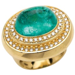 Cabochon Cut Paraiba 
Mozambique
 Tourmaline 
Diamonds set in 18 K Gold Ring