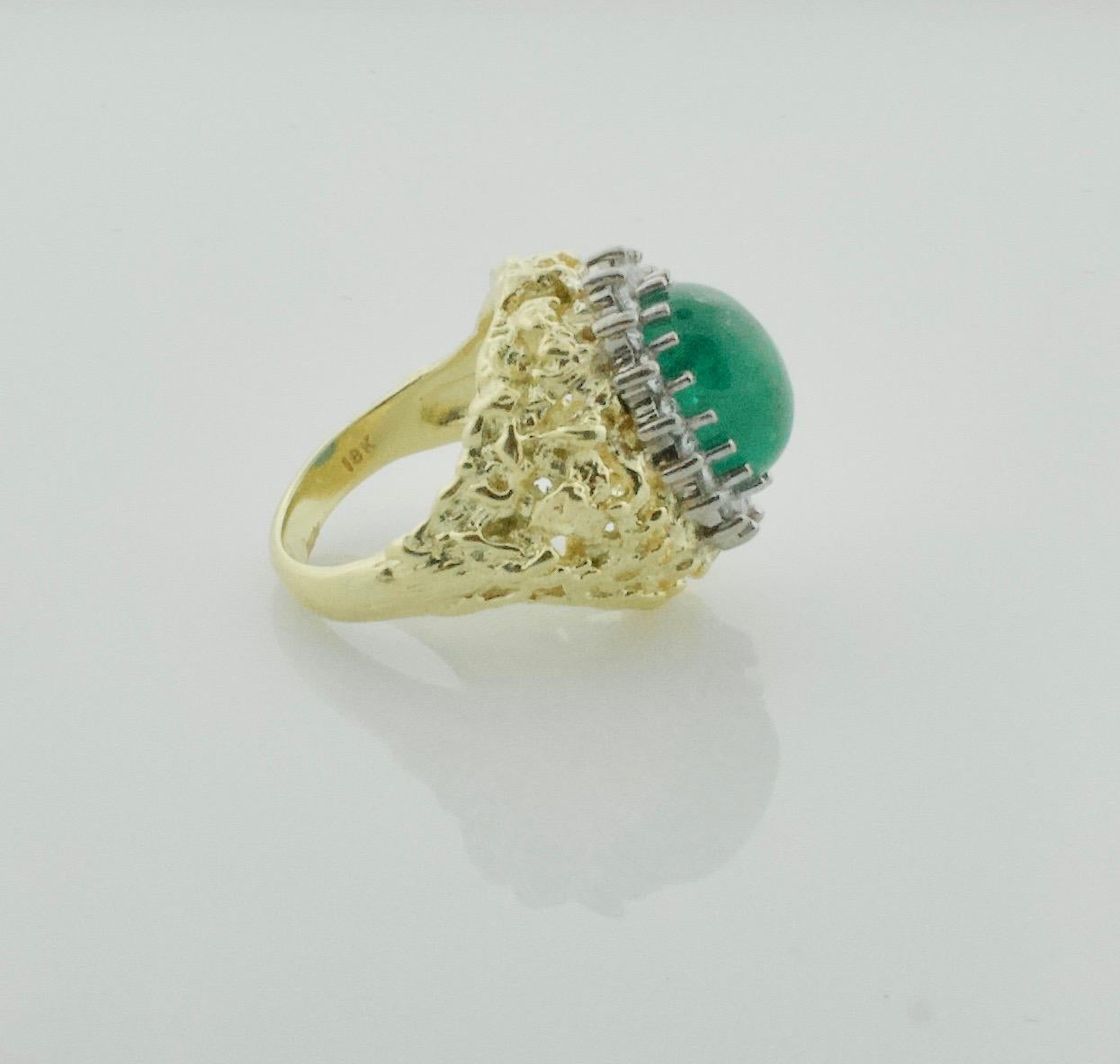 Cabochon Emerald and Diamond Ring in 18k Yellow Gold Circa 1960's
One Oval Cabochon Emerald Weighing 4.50 Carats Approximately (12.7 x 9.2 x 5.4 mm)
17 Round Brilliant Cut Diamonds Weighing .70 Carats Approximately [GH - VVS]
Currently Size 6.5 Can