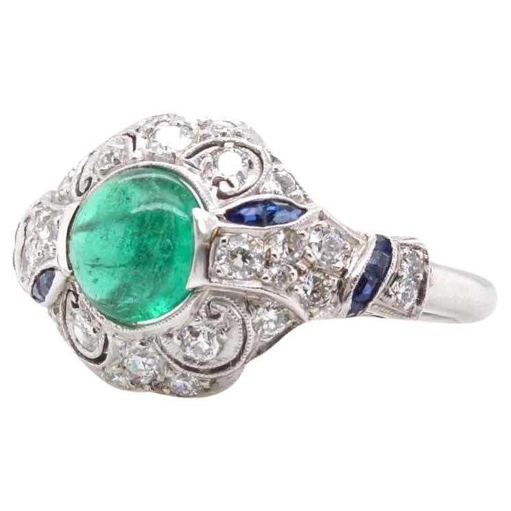 Cabochon emerald, brilliant cut diamonds and sapphires ring For Sale