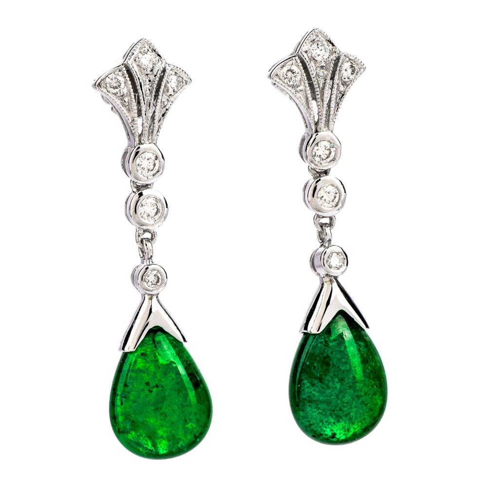 Dress in a distinguished manner with these high  Emerald 18K Gold Cabochon Drop Dangle Earrings.  These earrings are crafted in 18 karat white gold.  There are 12 glittering genuine diamonds, round cut, bezel and prong set of approximately