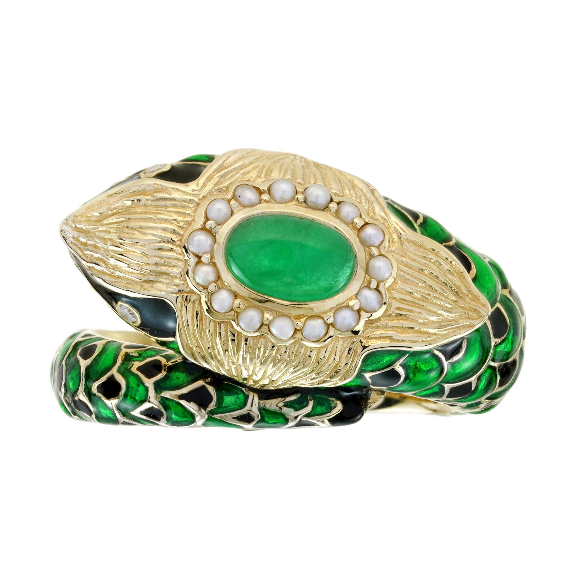 This antique-style Naka snake ring features a cabochon emerald set atop the snake’s head, encircled by lustrous pearls. The snake’s face is beautifully highlighted with intricate enamel work, while the scales are adorned with emeralds, adding a