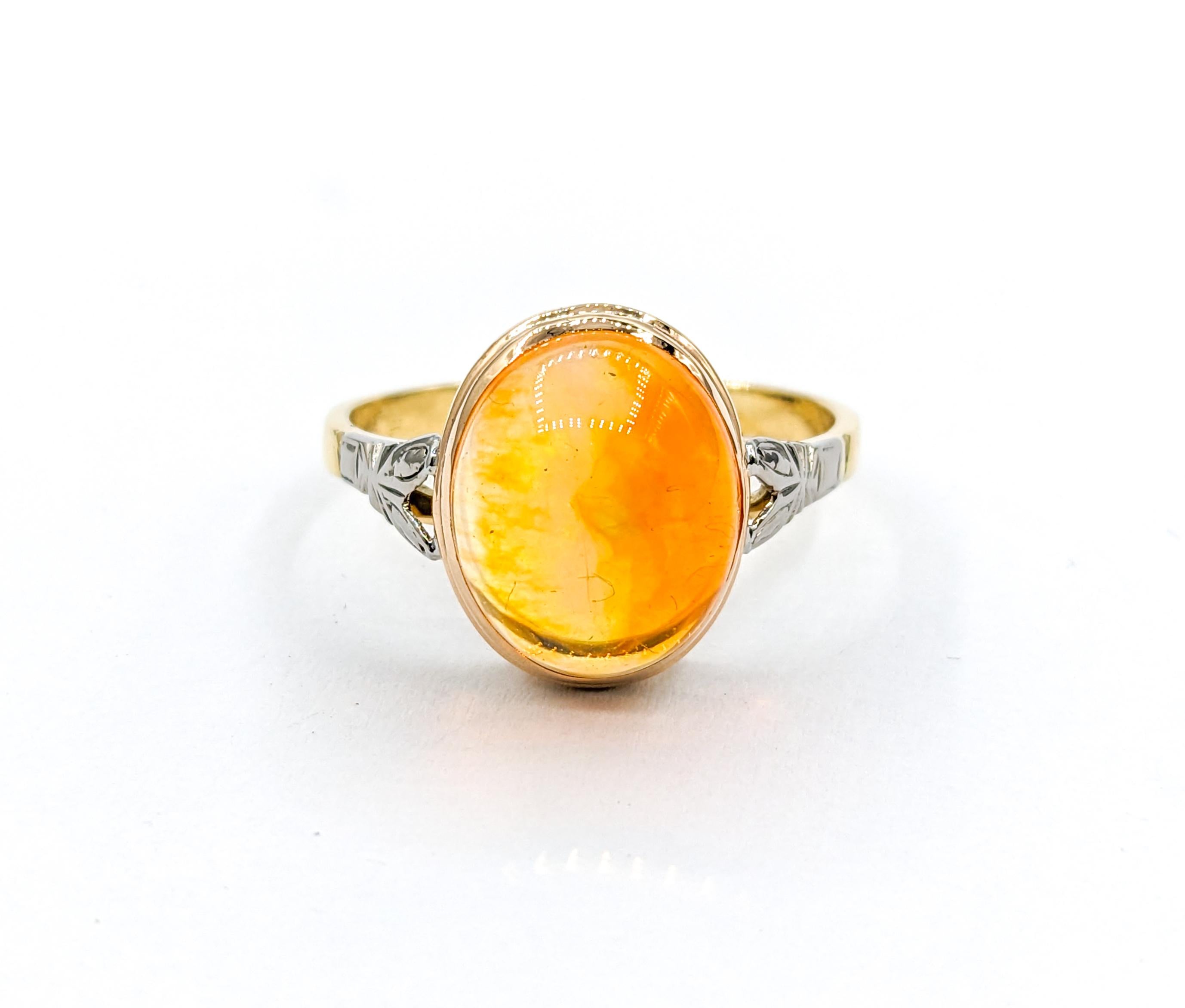 Cabochon Fire Opal Ring In Yellow Gold

Experience elegance with our Vintage Ring, meticulously crafted from 18kt yellow gold. This exquisite piece showcases a stunning 12x10mm Fire Opal, boasting exceptional clarity and a radiant fiery orange tone.