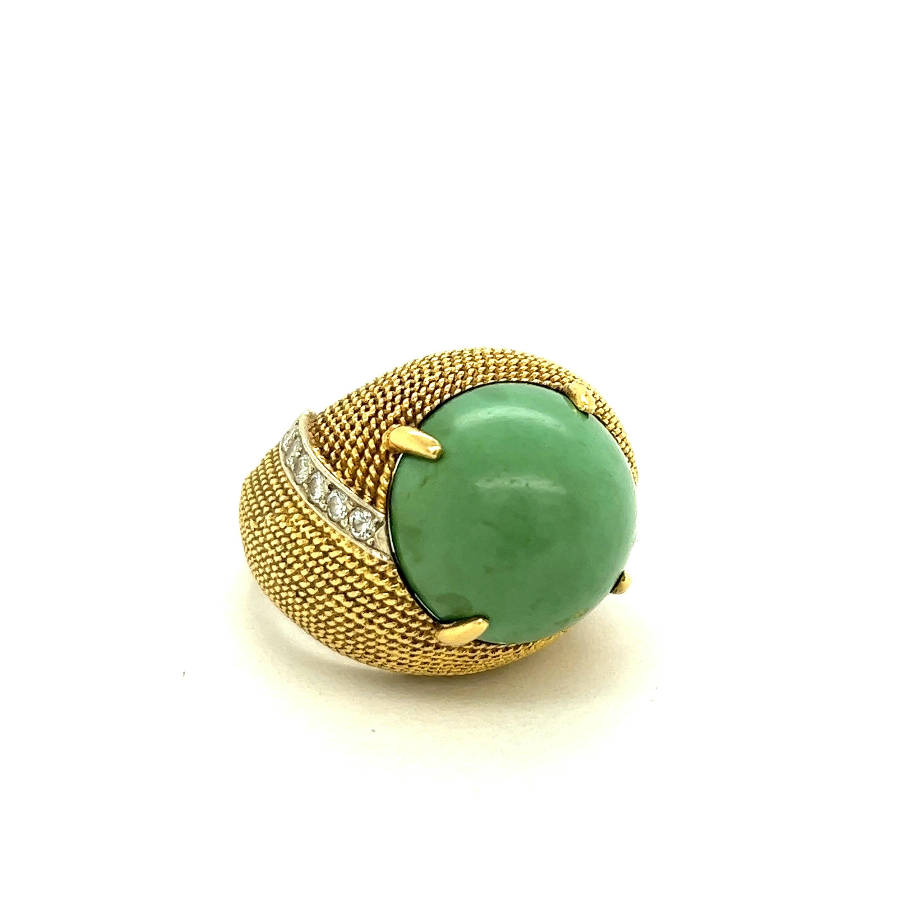 Cabochon Green Turquoise 18k Yellow Gold Cocktail Ring

Large cabochon shape green turquoise (15 x 15 mm), set on 18 karat yellow gold with twisted rope motif; marked 18k

Ring's top width 19.3 mm, length 23.7 mm

Size: 6.75 US 
Total weight: 15.5