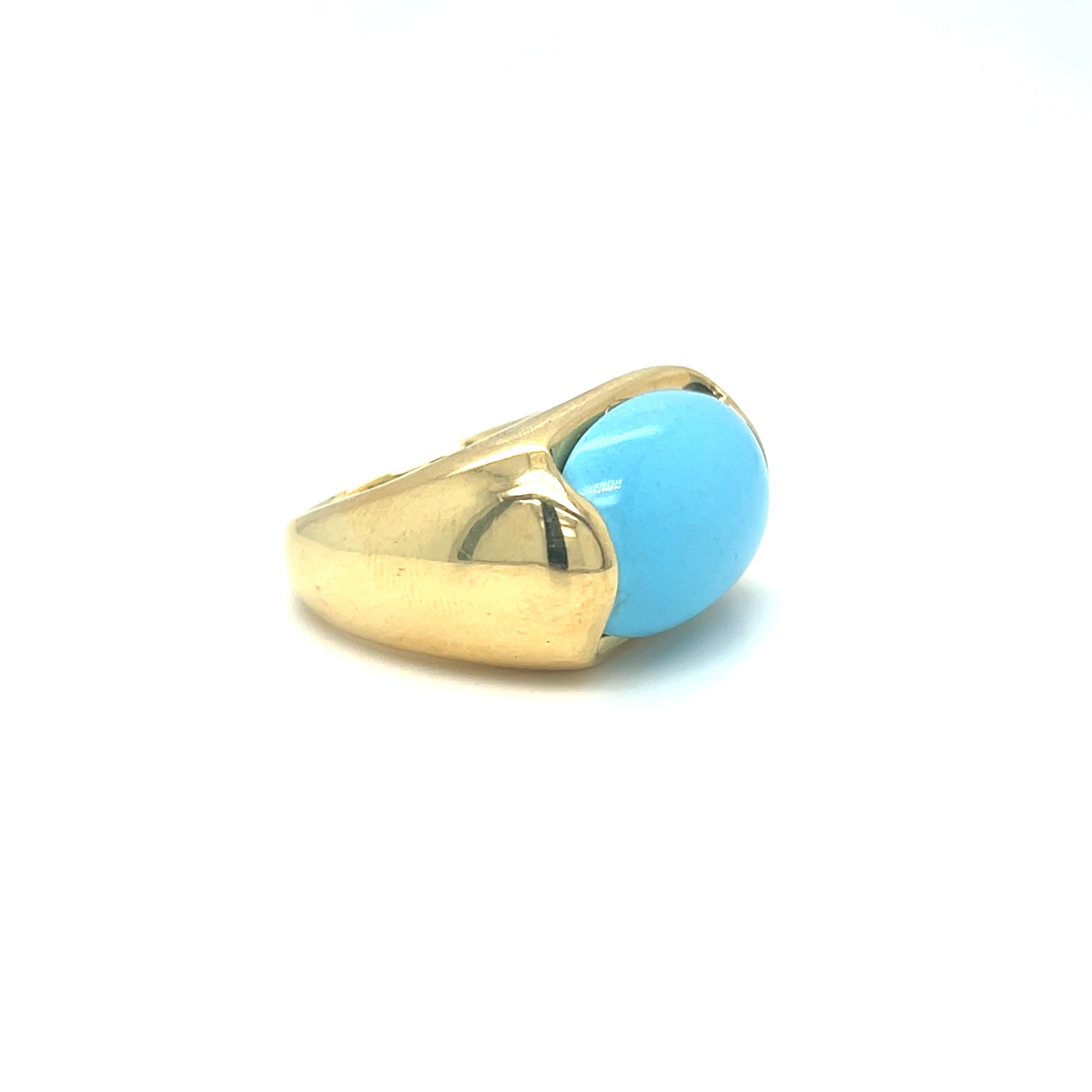 This stunning light blue turquoise cabochon in a rectangle shape is beautifully set in a wide, puffy band crafted from 18k yellow gold. The ring top measures 1.25 x 2.5 cm, creating a striking statement piece that combines vibrant color with a bold