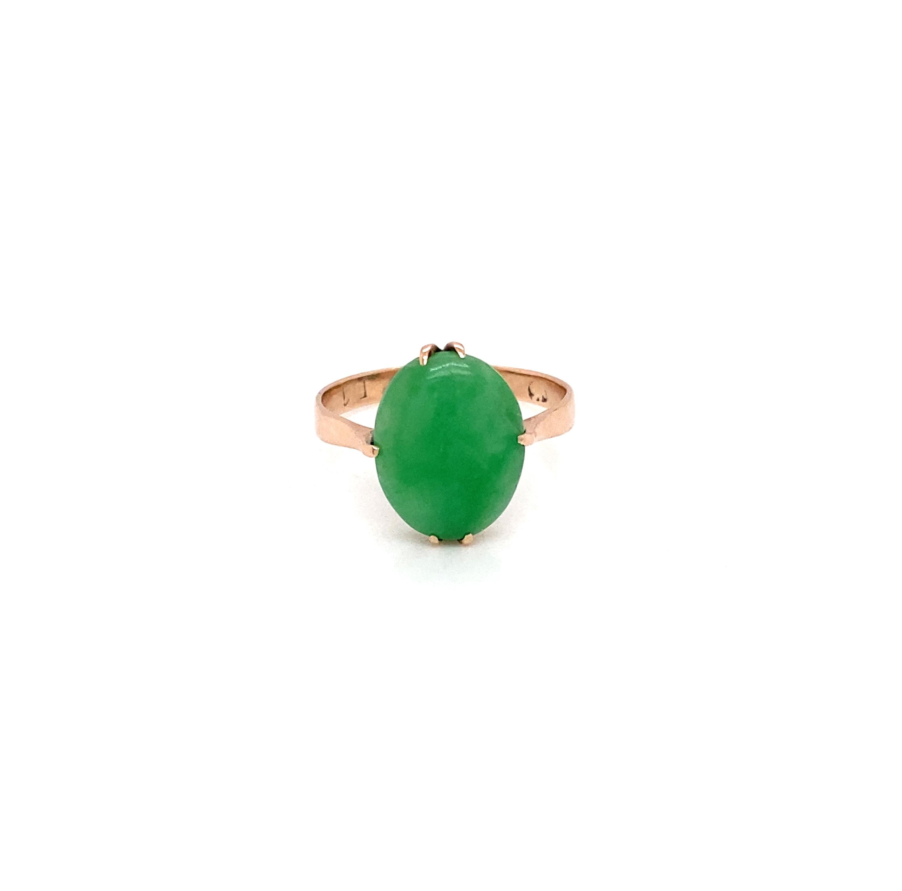 Full of colour, this wonderful vintage cocktail ring will surely brighten your days every time you wear it.

At the heart of this charming piece sits proudly a 12.3x 10mm sleek, vivid apple green oval cabochon opaque jadeite, securely held in place
