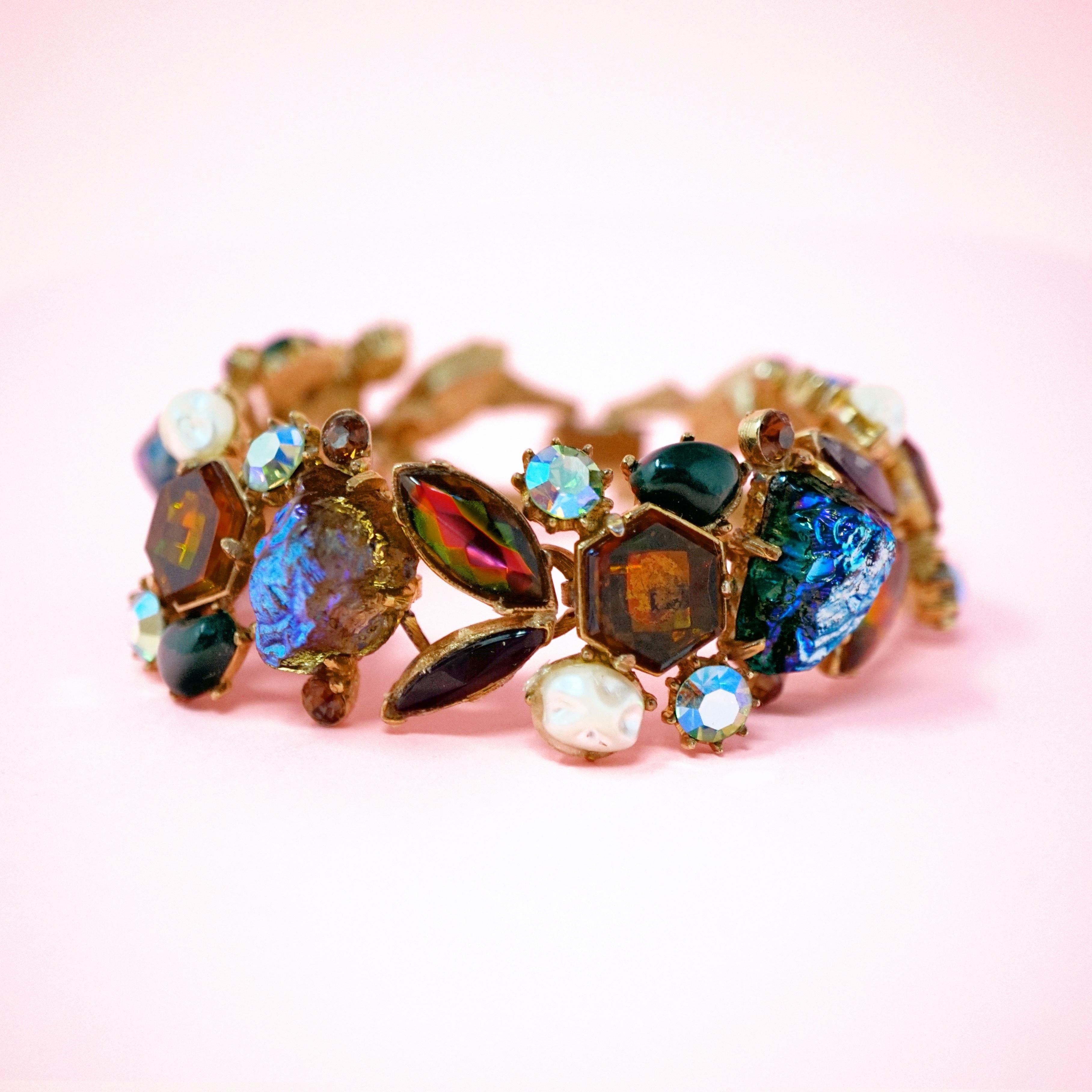 This unique gilded statement bracelet by Florenza is a real eye catcher! A medley of striking cabochons including faux pearls, Aurora Borealis crystals and faceted amber-colored rhinestones come together for a truly mesmerizing look!

ABOUT