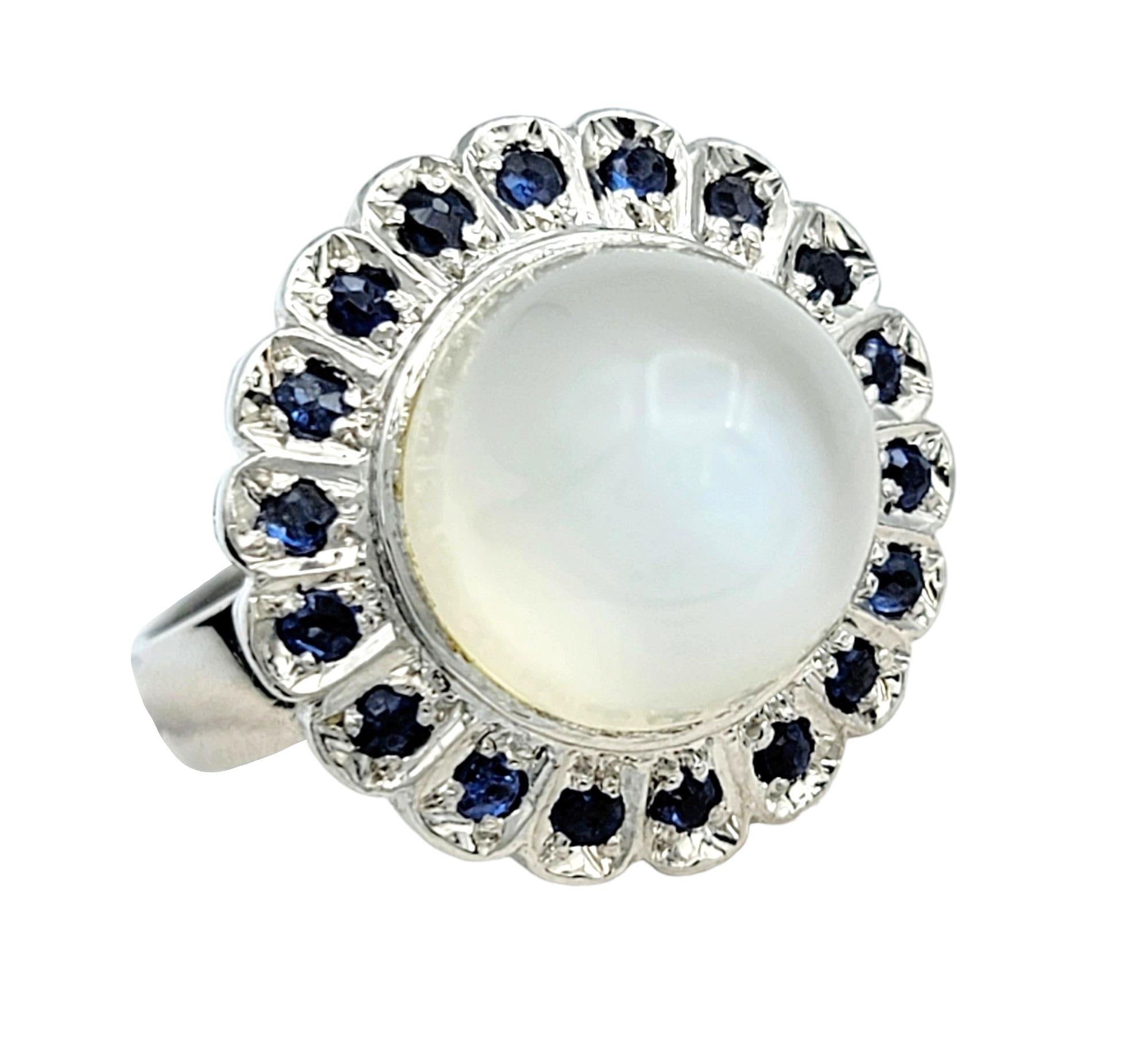 Ring Size: 5 

Introducing our cabochon moonstone domed cocktail ring, a mesmerizing piece that effortlessly combines timeless elegance with modern flair. Set in a lustrous 10k white gold, the cabochon moonstone takes center stage, displaying a