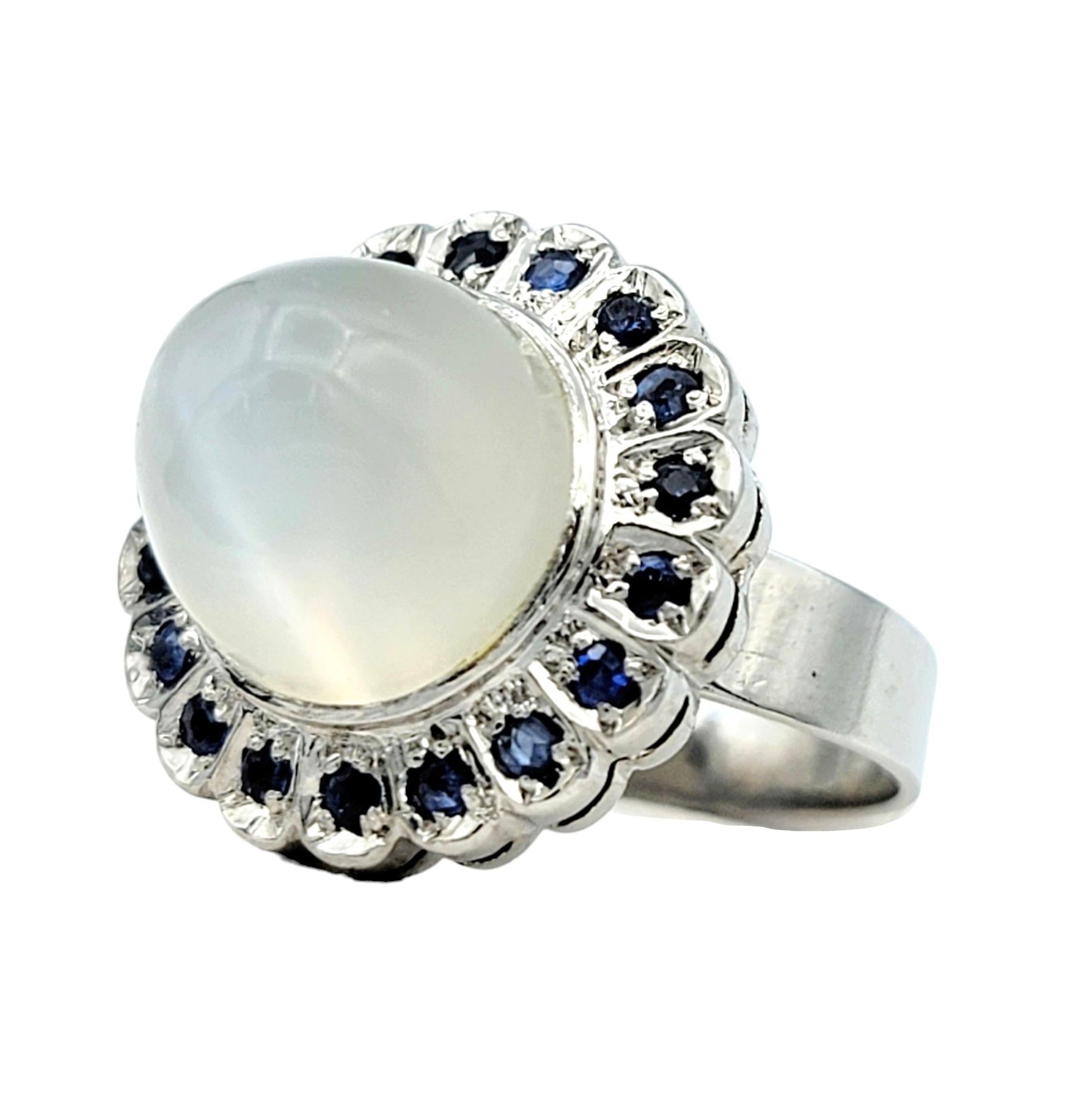 Contemporary Cabochon Moonstone Domed Cocktail Ring with Sapphire Halo in 10 Karat White Gold For Sale