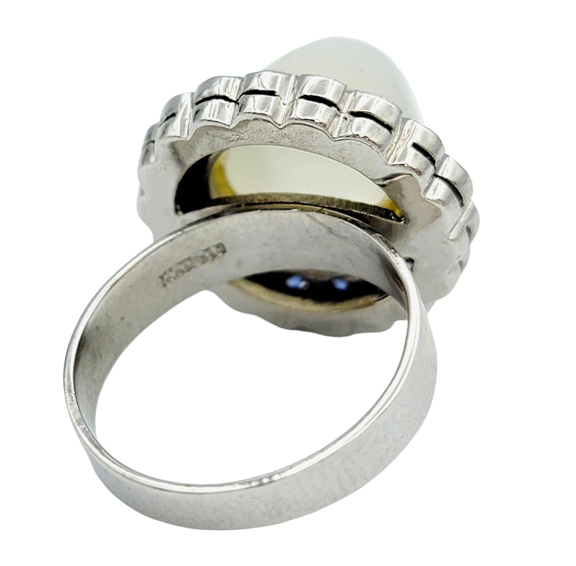 Women's Cabochon Moonstone Domed Cocktail Ring with Sapphire Halo in 10 Karat White Gold For Sale