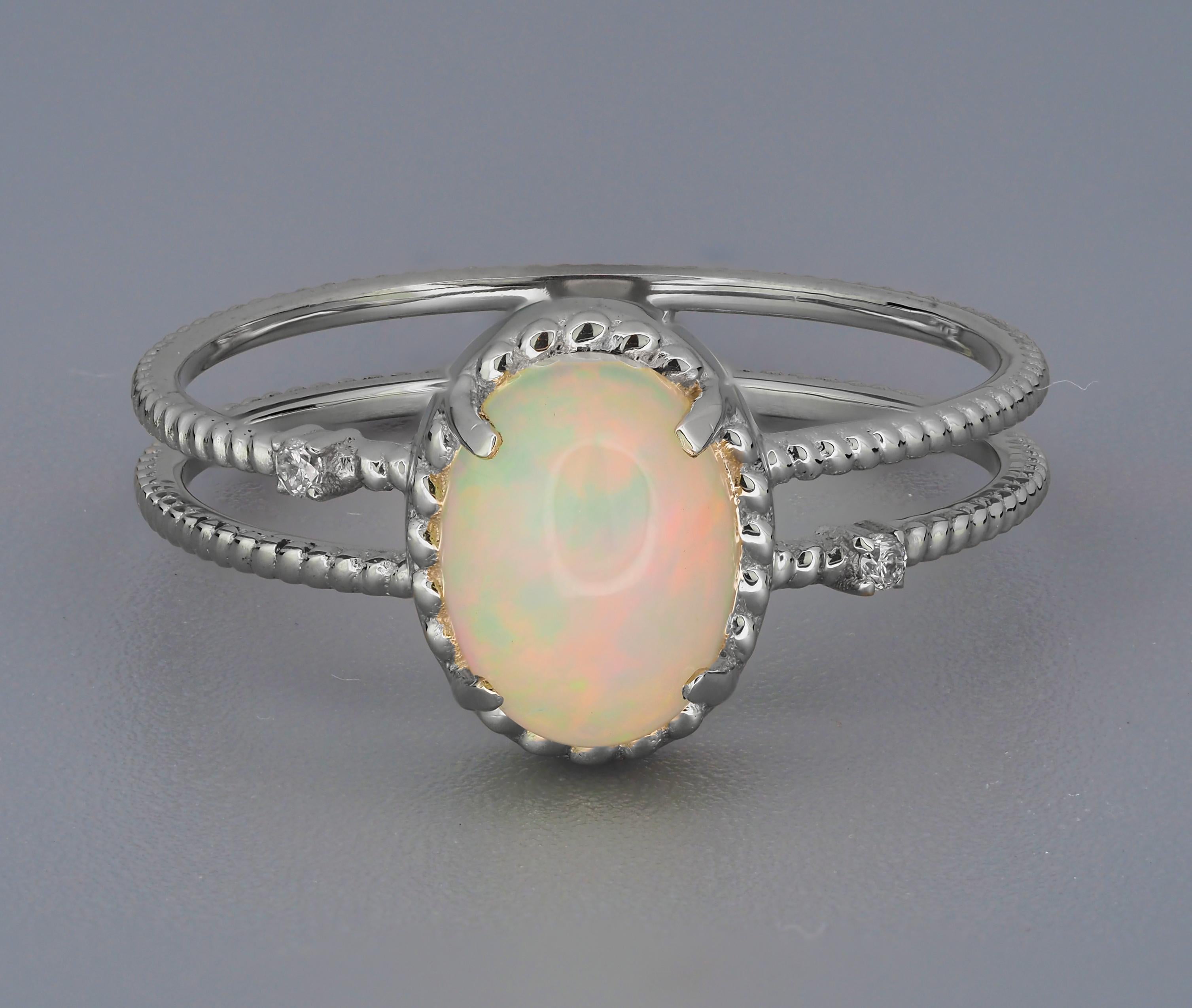 Cabochon opal 14k gold ring. 
Gold ring with Opal. Minimalist opal ring. Opal engagement ring. Opal promise ring. Opal Birthstone Ring.

etal: 14k gold
Weight: 2 g. depends from size.

Central stone: Opal
Cut: oval cabochon
Weight: aprx 1.2