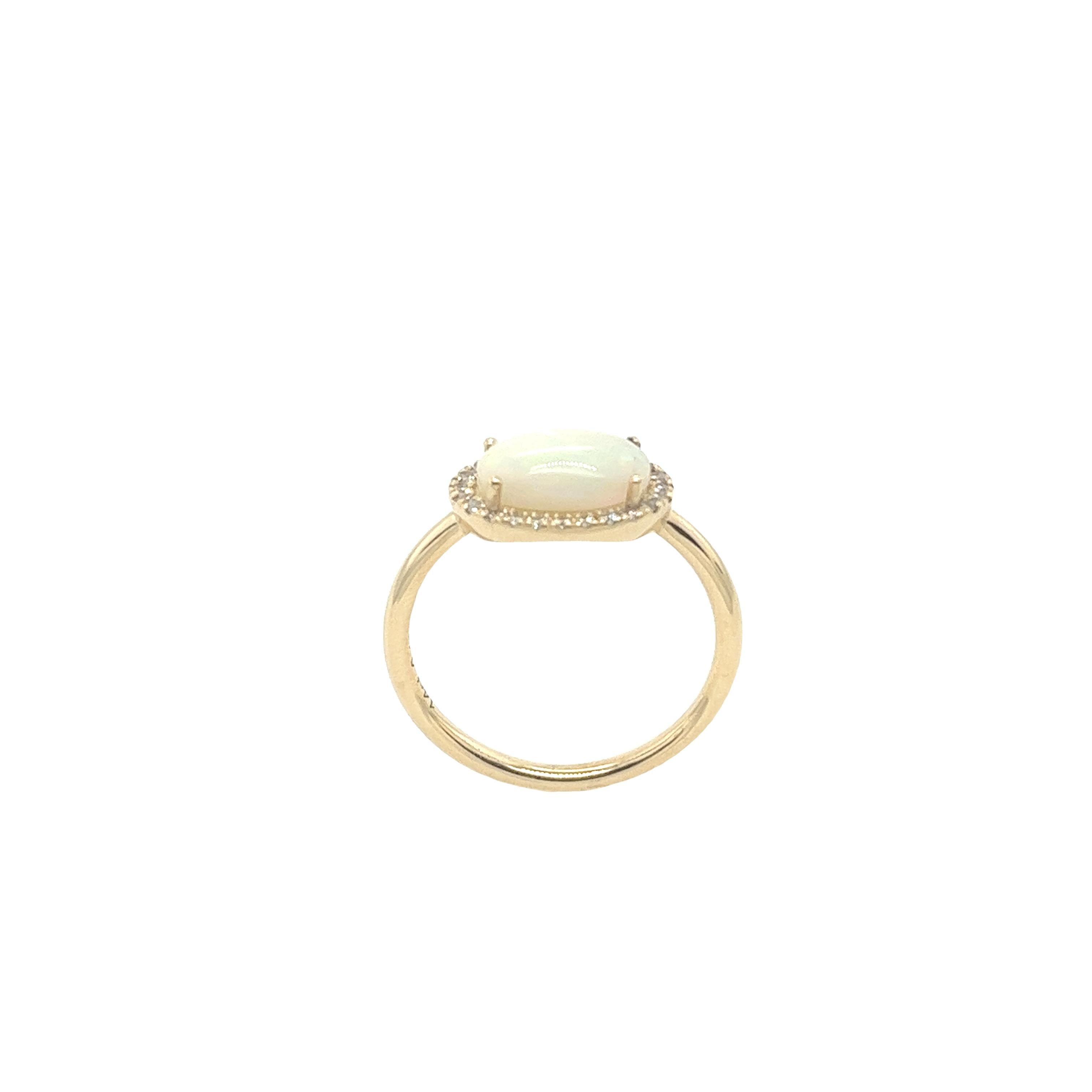 Our classic oval cabochon opal ring surrounded by 24 dazzling small diamonds, set in exquisite 14ct yellow gold setting.
Total Weight: 2.4g
Total Opal weight: 1.83ct
Total Diamond Weight: 0.16ct
Diamond Colour: H
Diamond Clarity: SI1
Ring Size: