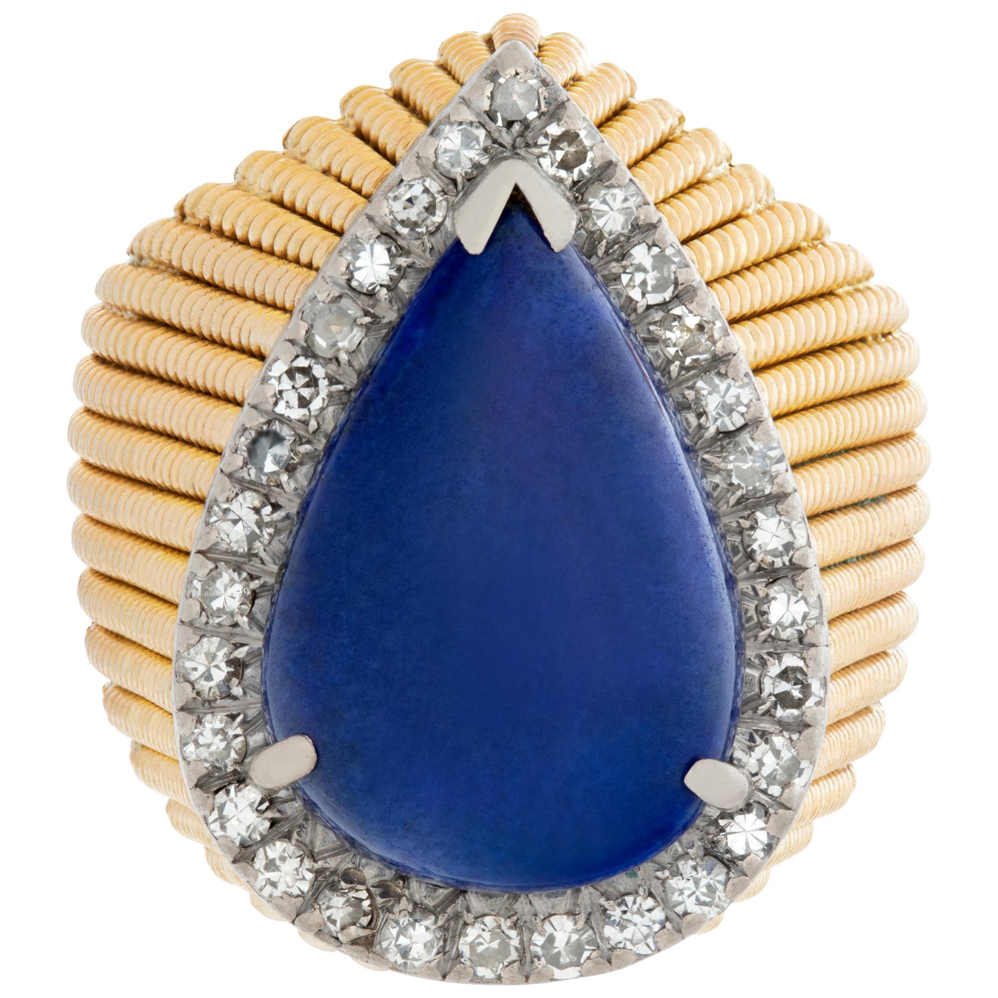 Cabochon pear shape cut lapis lazuli ring in 14k textured yellow gold, with approx. 0.50 carat round brilliant cut diamonds, estimate G-H color,  VS clarity. Size 6.5.This Lapiz ring is currently size 6.5 and some items can be sized up or down,