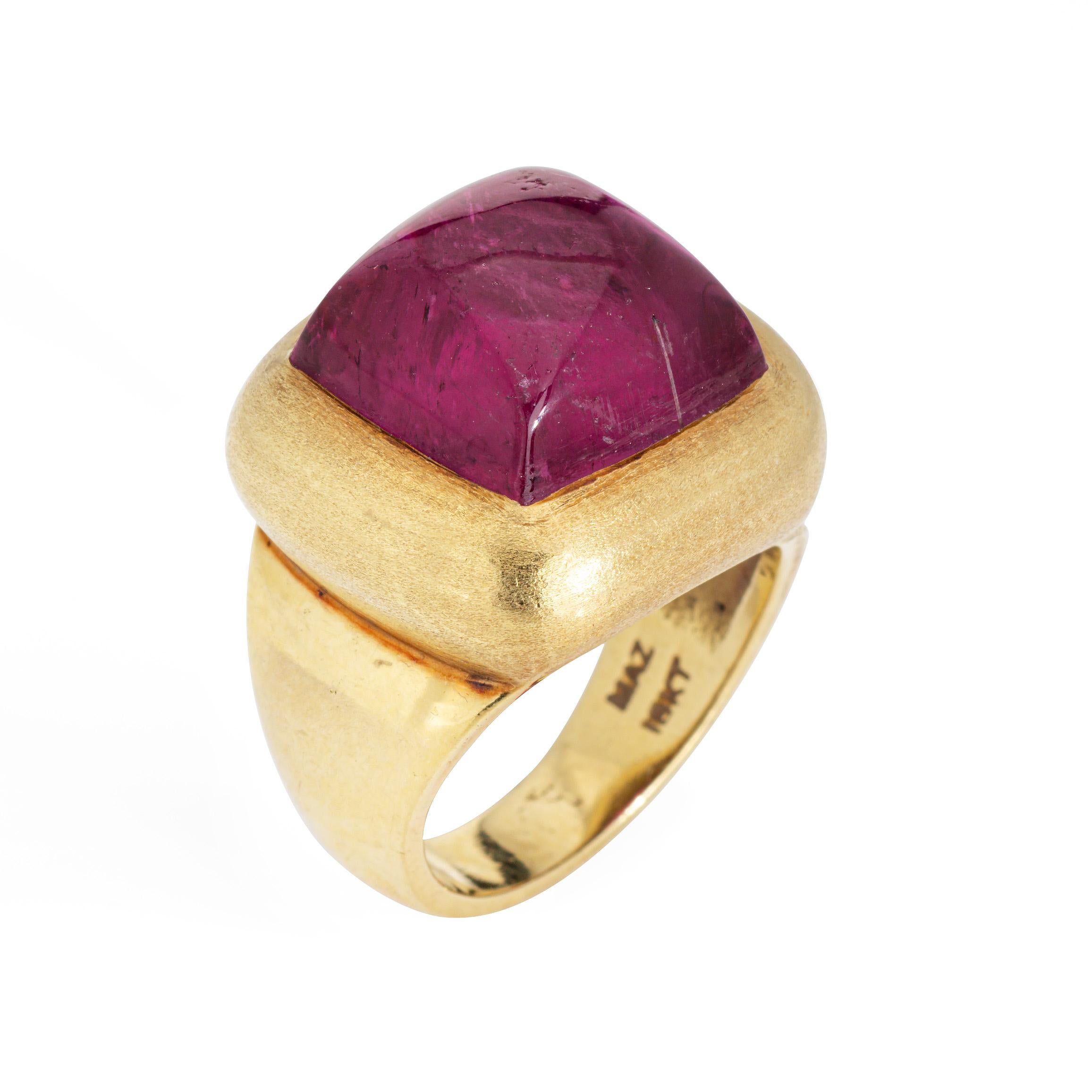 Stylish Maz pink tourmaline ring crafted in 18k yellow gold. 

Cabochon cut pink tourmaline measures 13mm diameter. The tourmaline is in very good condition and free of cracks or chips.    

The bright Fushia pink tourmaline is the star of the ring,