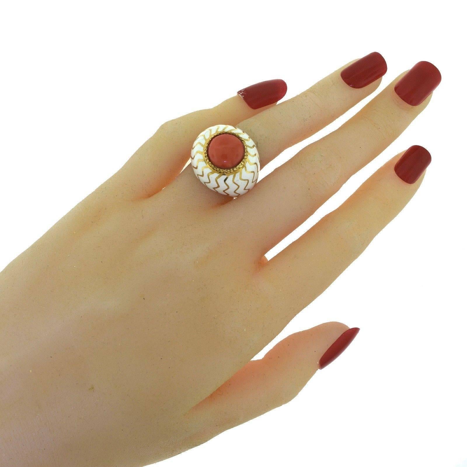 Style: Dome / Cocktail

Metal: Yellow Gold

Metal Purity: 18k 

Stone: 1 Cabochon Red Coral

Coral Diameter: 9.67 mm 

Non-Metal Material: White Enamel 

Total Item Weight (g): 14.5

Ring Size: 6.25 (sizable)

Ring Height: 15.24 mm

Ring Diameter: