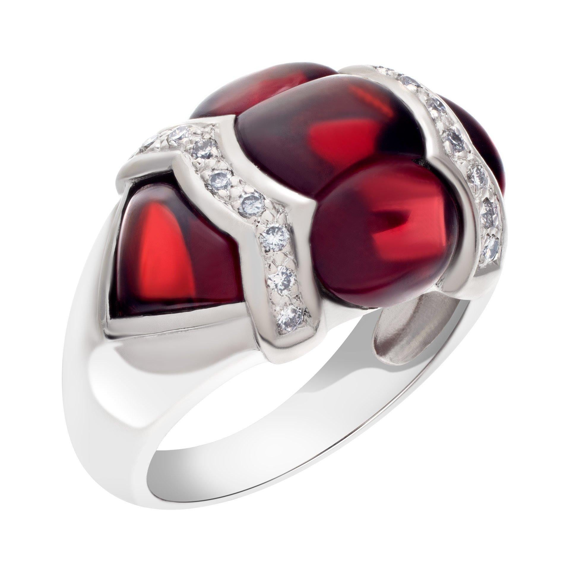 Eye catching cabochon red garnet ring with diamond accents that total 0.20 carat set in 18k white gold. Size 6

This Diamond ring is currently size 6 and some items can be sized up or down, please ask! It weighs 7.1 pennyweights and is 18k White