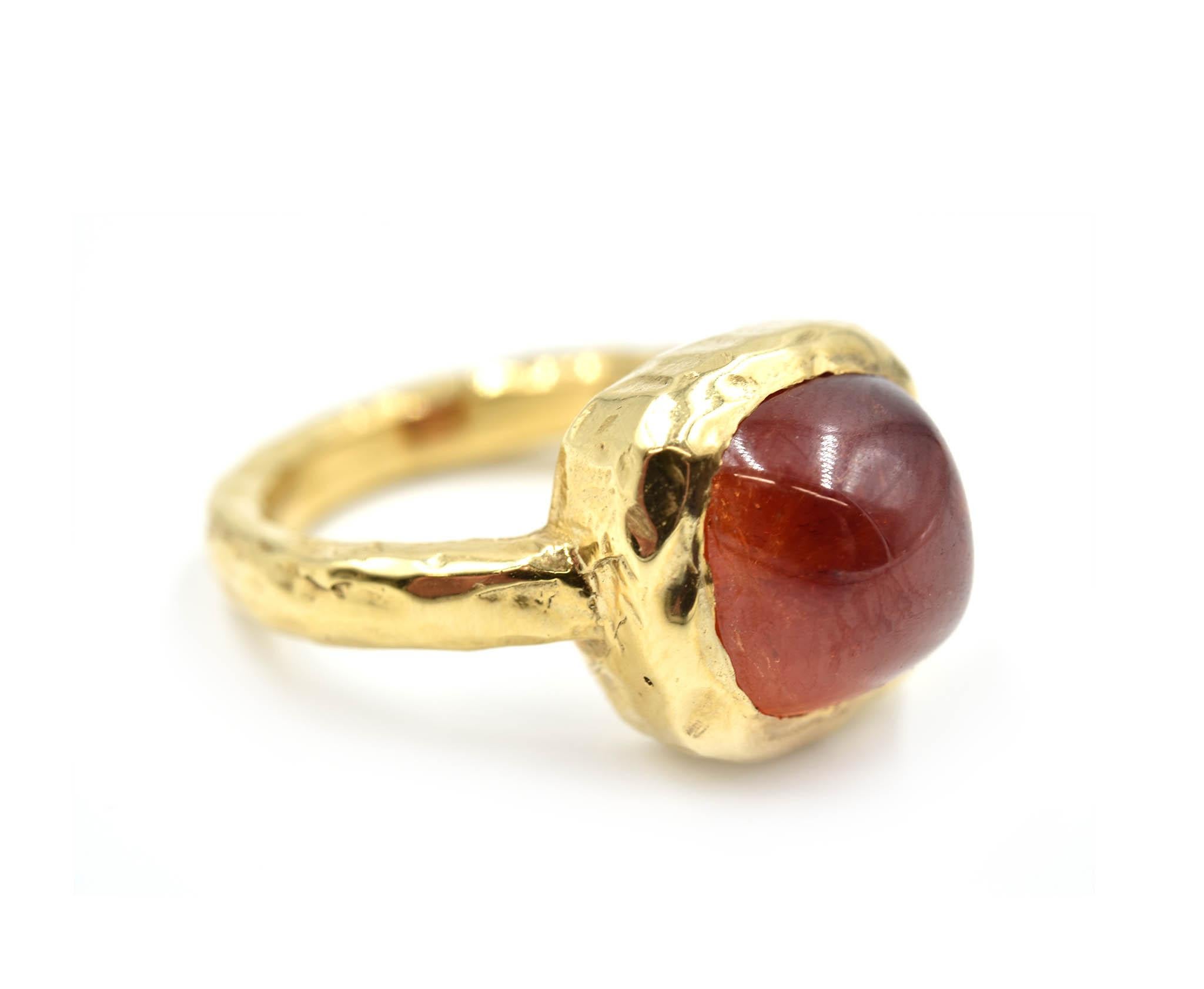 Designer: custom design
Material: 14k yellow gold
Red Tourmaline: cabochon cut red tourmaline 9.7x9.7mm
Ring Size: 5 1/4 (please allow two additional shipping days for sizing requests)
Weight: 9.00 grams
