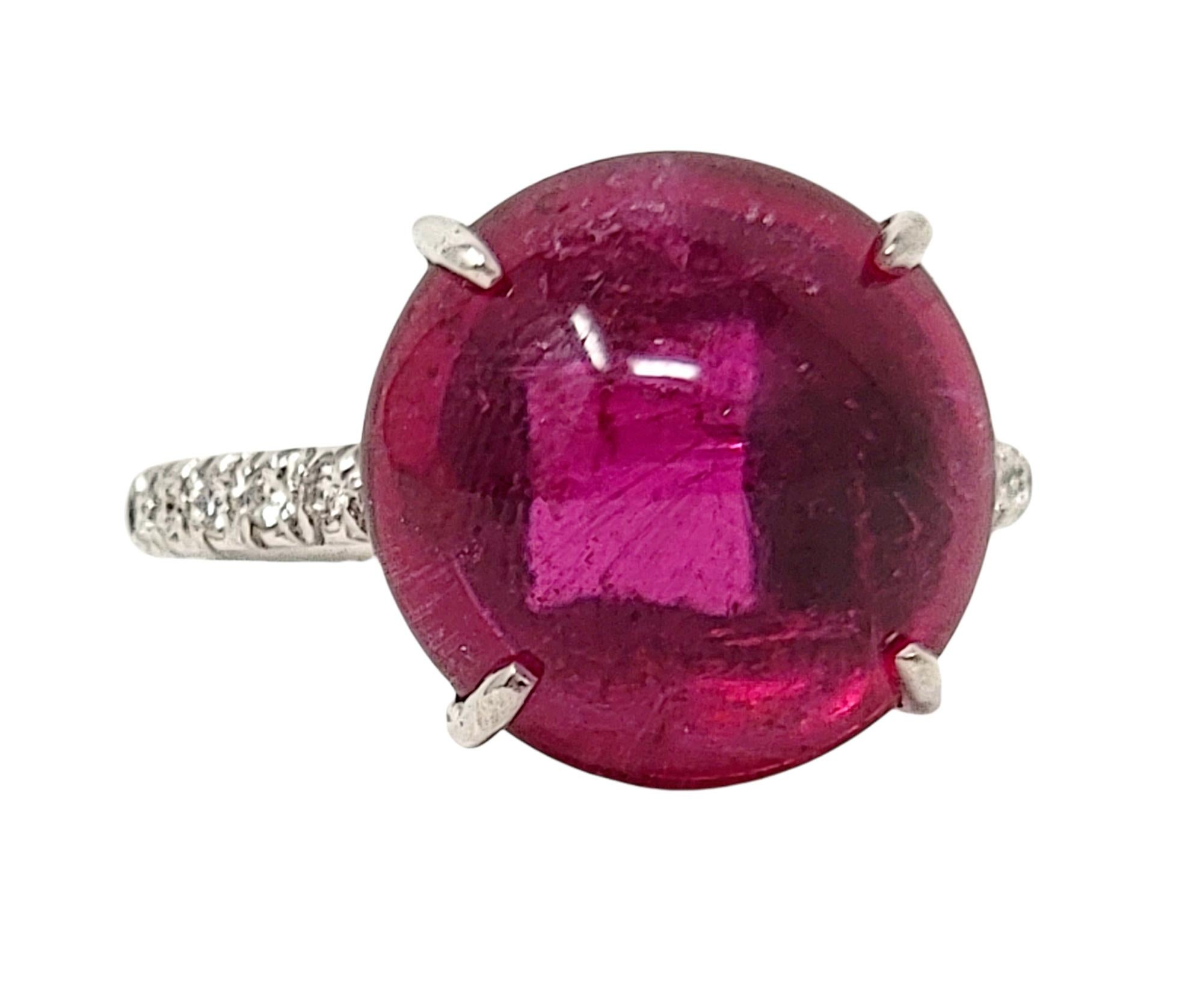 Ring size: 6

Stunning rubelite and diamond cocktail ring bursting with brilliant color! This gorgeous and unique piece features a single round cabochon rubelite stone 4 prong set at the center of the piece. The vibrant stone is an amazing