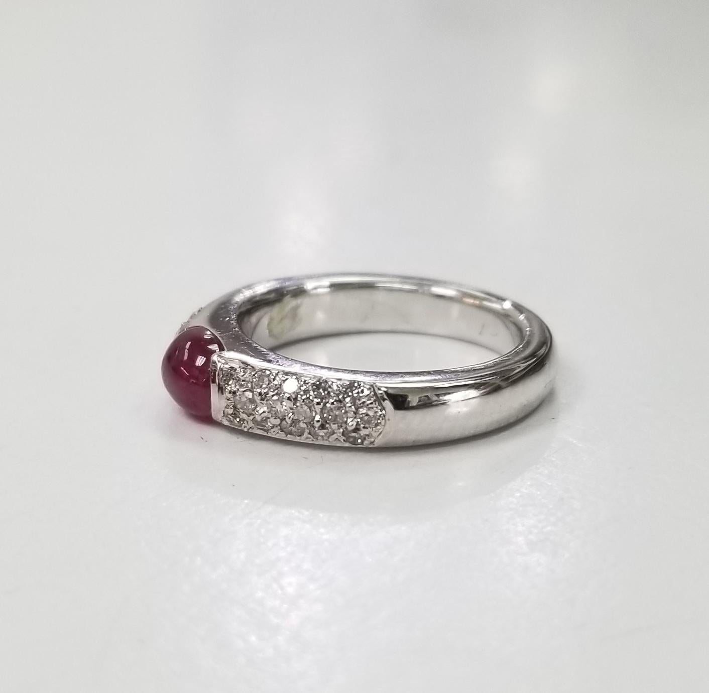 14k white gold ruby and diamond ring containing 1 cabochon cut ruby weighing .98pts. and 36 round full cut diamonds of very fine quality weighing .30pts. set in a 4mm wide ring.  This ring is a size 4.75 but we will size to fit for free.