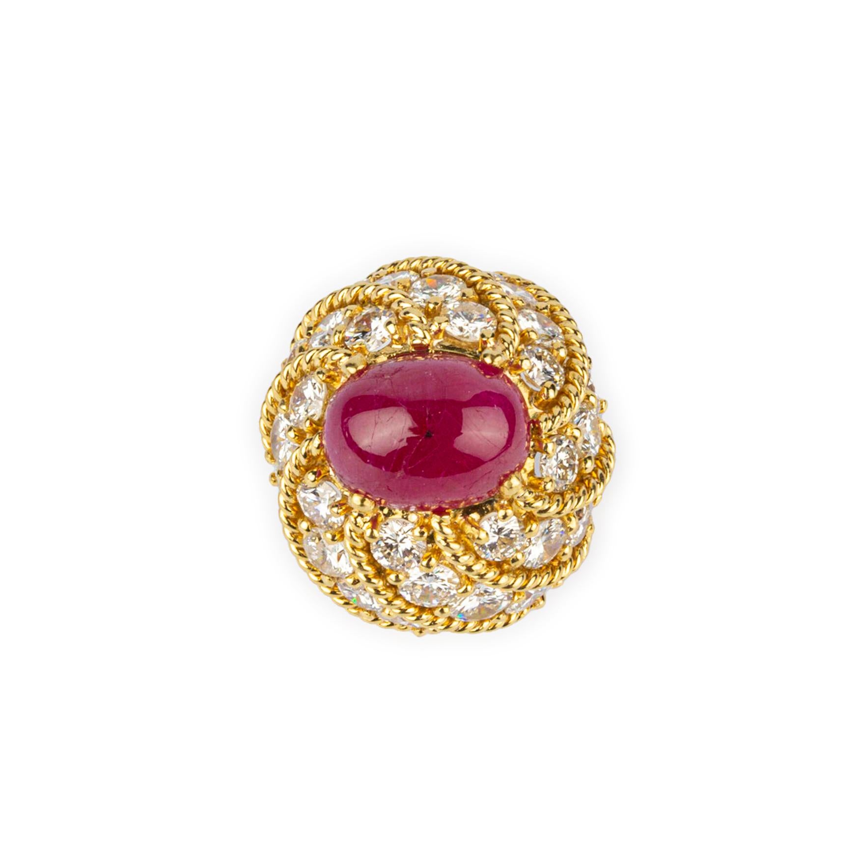 A Beautiful Cabochon Ruby & Diamond Cocktail Ring in 18k Yellow Gold. Made in the USA, circa 1970. 
Mounted with 30 Round Diamonds Weighing 6.50 cts
E-F Color VVS-VS Clarity
Ruby Weighs 5.00 cts