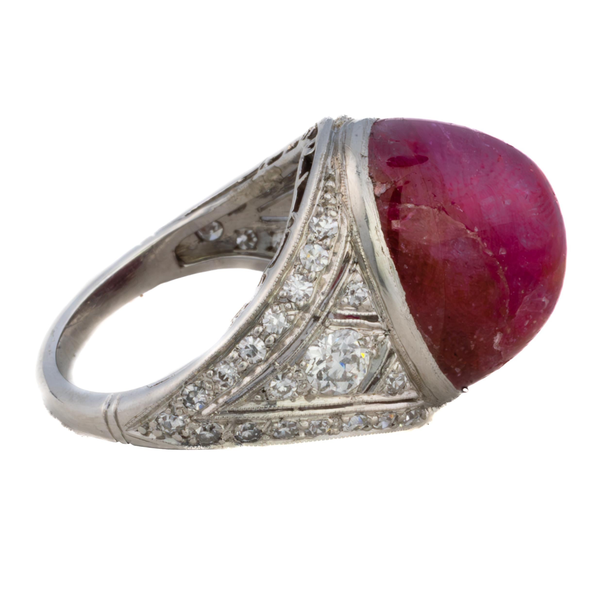 Cabochon Ruby and Diamond Ring

This captivating ring showcases an extraordinary cabochon-cut ruby, weighing an impressive 29.79 carats, radiating with its rich and velvety hue. Surrounding the centerpiece are shimmering diamonds, totaling