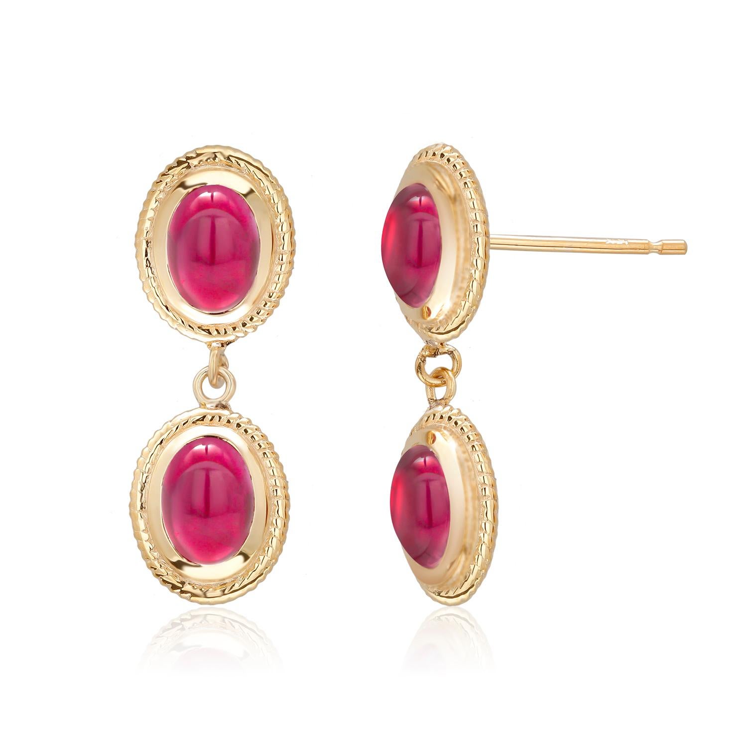 Fourteen karats yellow gold drop earrings 
Four bezel set cabochon Burma ruby weighing 4.50 carats
Ruby hue tone color is of rose red
New Earrings
Handmade in the USA
Earrings are hanging off a straight post with friction push backs 
Our design team