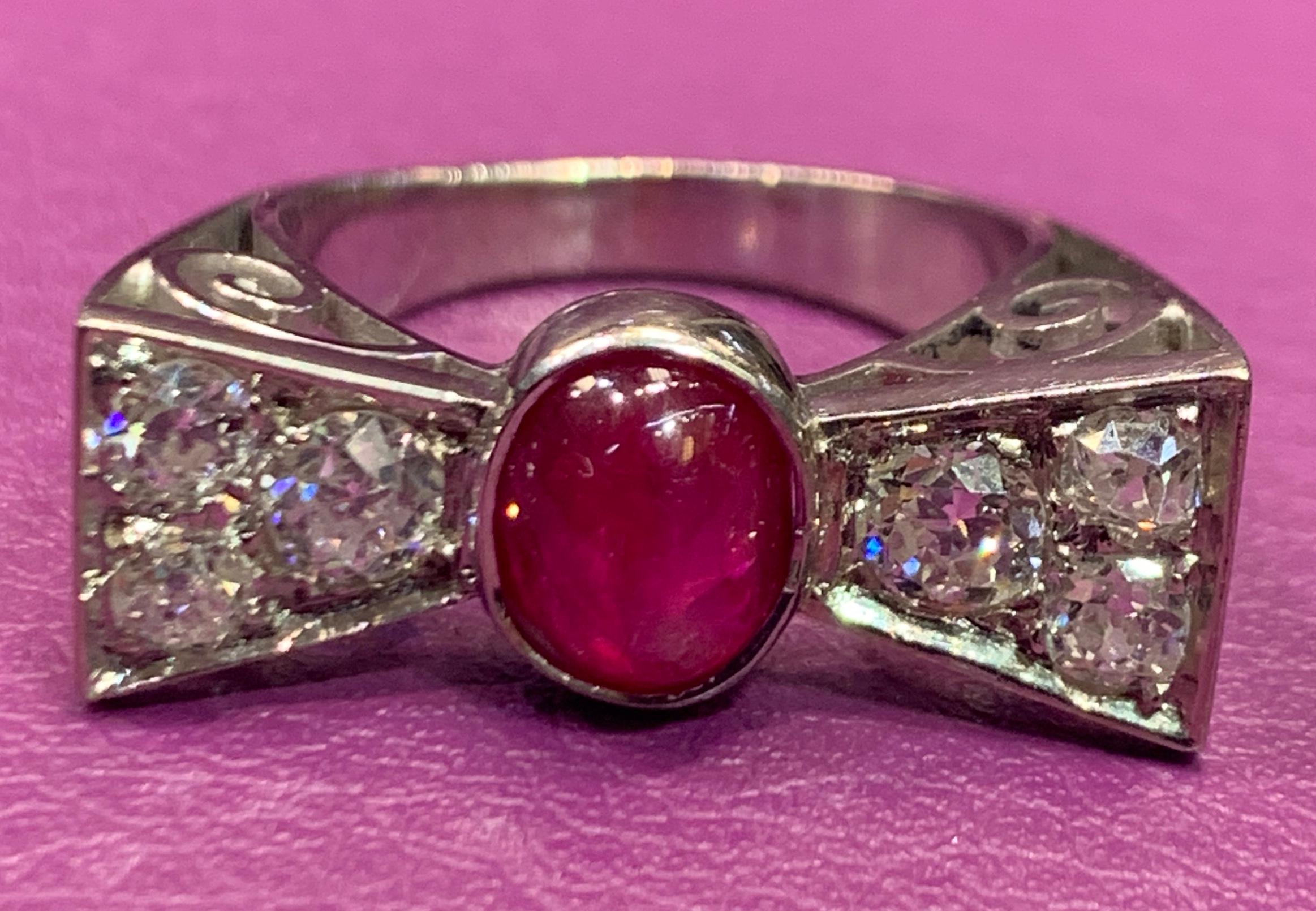 Cabochon Ruby & Diamond Bow Tie Ring 
Ruby Weight: Approximately 2.25 Cts
Diamond Weight: .85 Cts
Ring Size: 6.5
Re-sizable free of charge 

