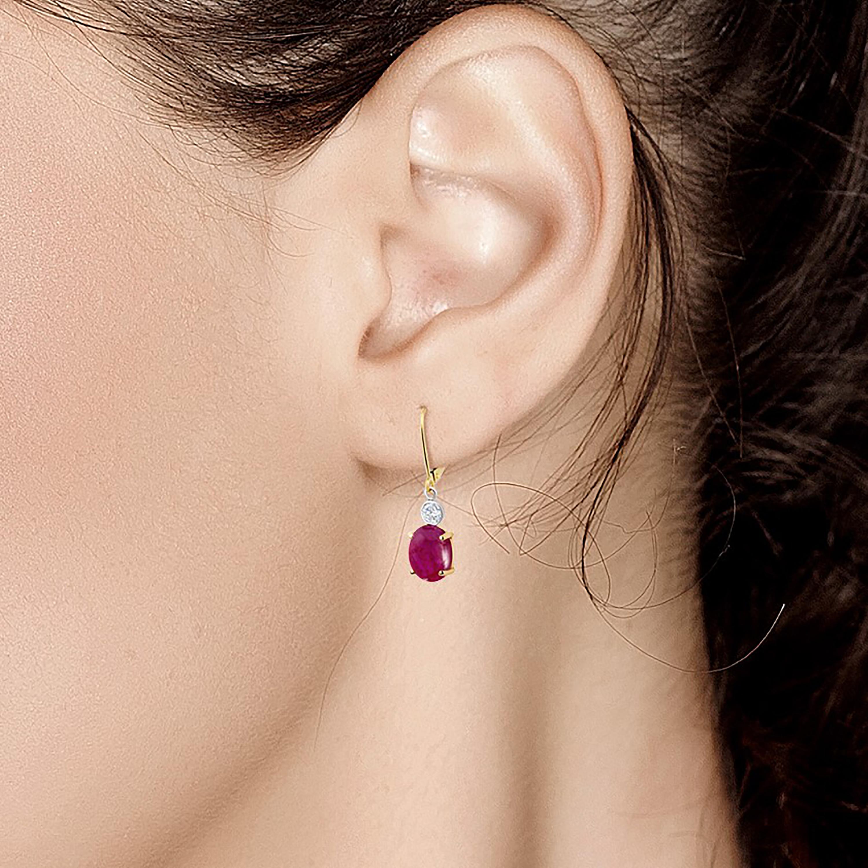 Fourteen karats white and yellow gold drop hoop earrings 
Two cushion-shaped cabochon rubies weighing 3.55 carat 
Two Diamonds weighing 0.20 carat 
Rubies hue color is jasper red
One of a kind earrings 
New Earrings 
14 karat gold wire wrapped hoops
