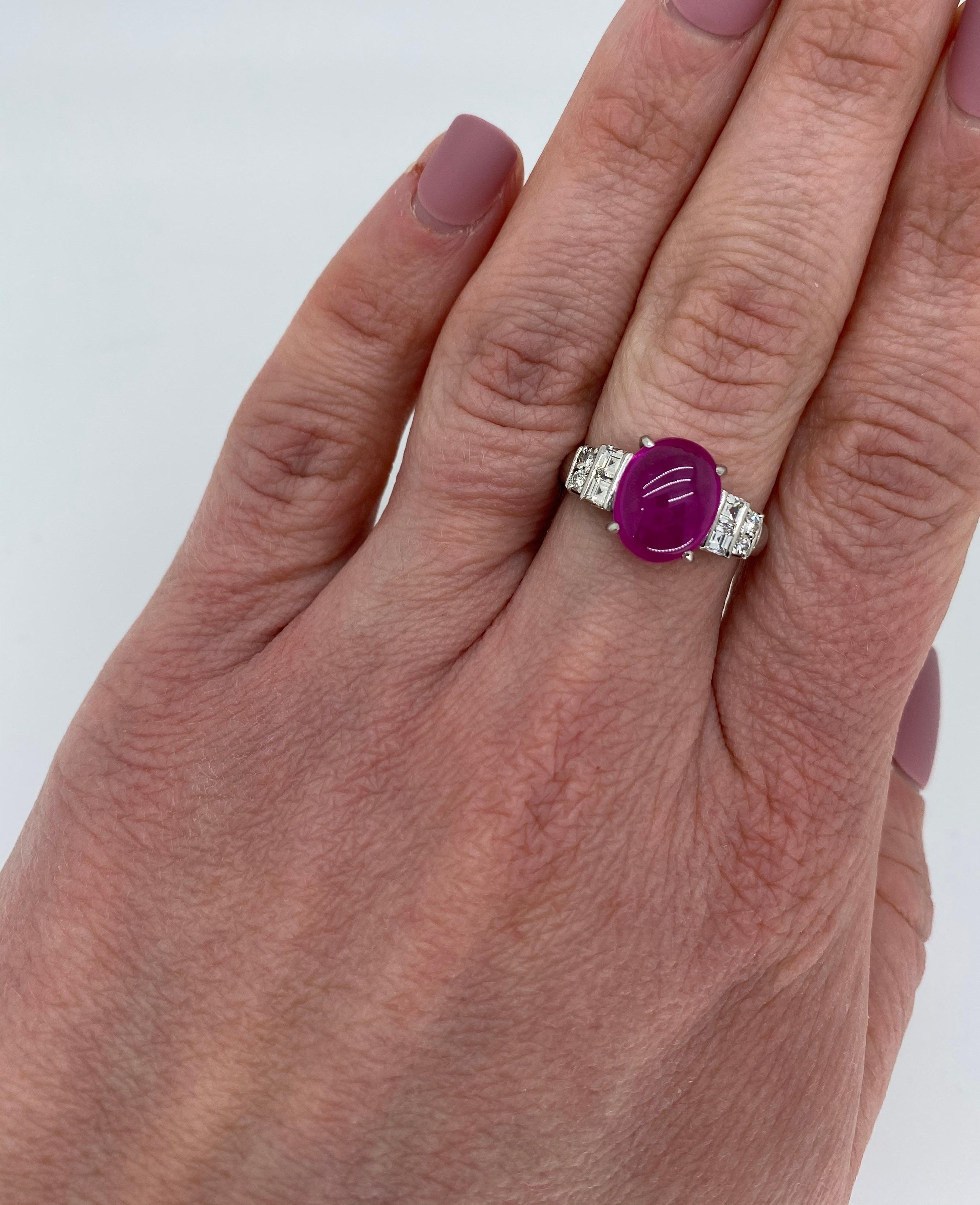 Unique diamond cabochon cut ruby cocktail ring crafted in platinum.

Gemstone: Cabochon Cut Ruby & Diamonds
Gemstone Carat Weight:  Approximately 4.30CT
Diamond Carat Weight:  Approximately .52CTW
Diamond Cut: Round Brilliant Cut Diamonds and Square
