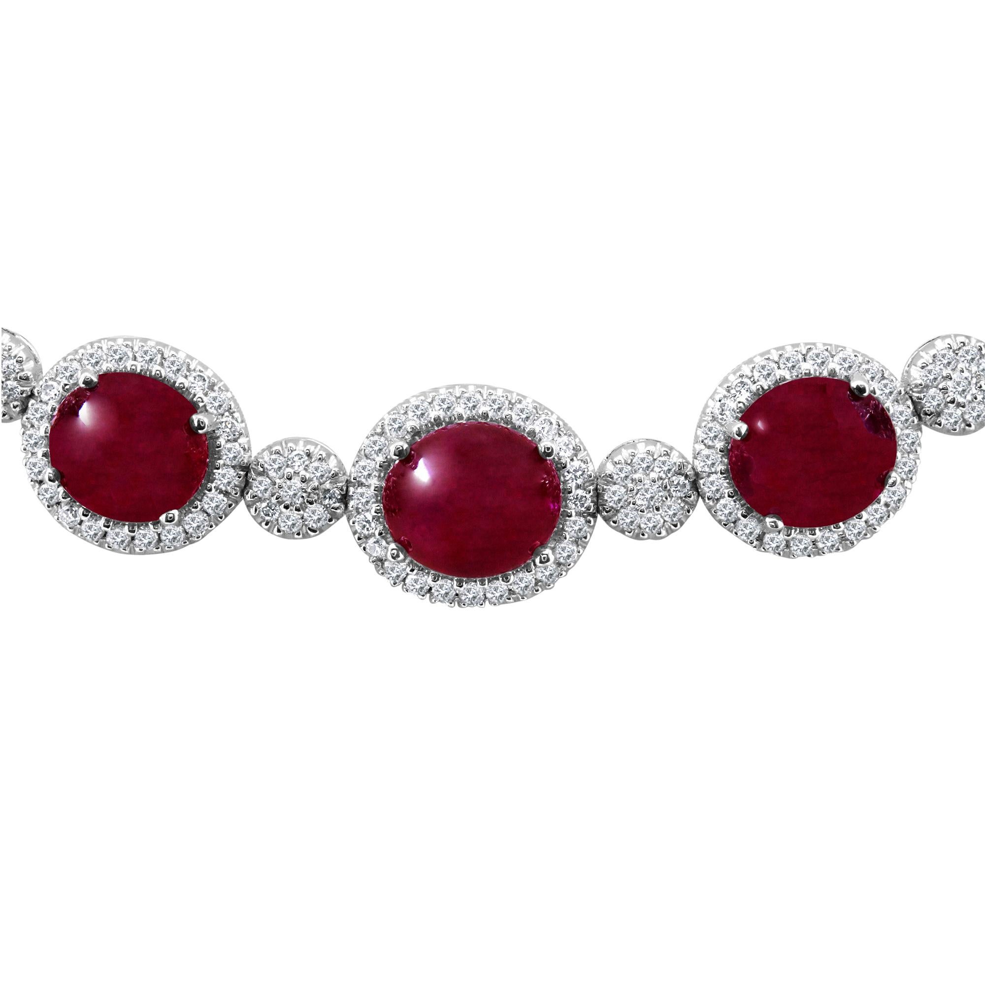 13.79 carat Cabochon Rubies, with diamond halo, alternating with round diamonds, 1.44 carat total diamond weight.

Clasp: Tongue in box clasp with safety latch. 

Length: 16 3/4