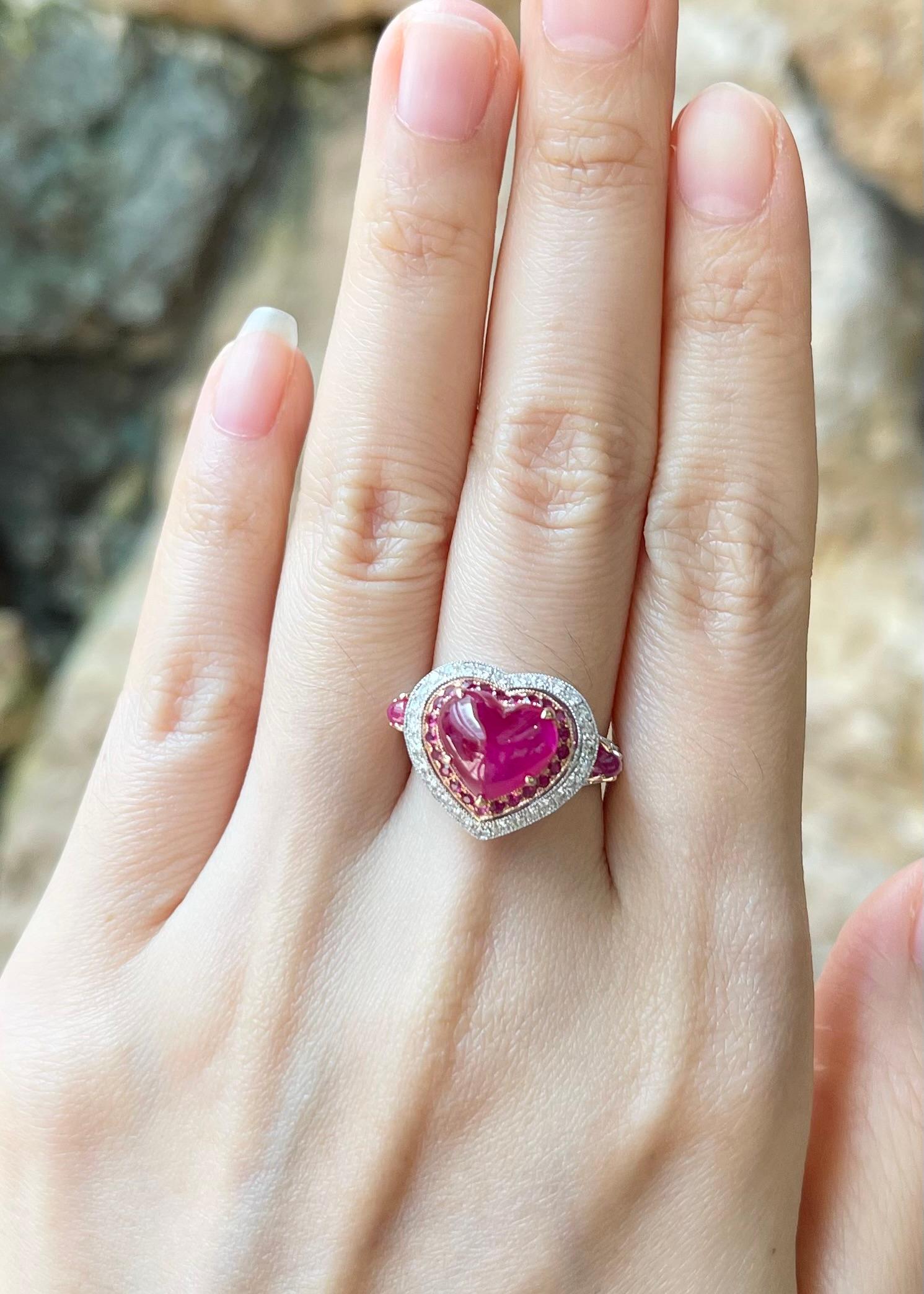 Cabochon Ruby 4.14 carats with Cabochon Ruby 0.48 carat, Ruby 0.28 carat and Diamond 0.31 carat Ring set in 18K White/Rose Gold Settings

Width:  2.1 cm 
Length: 1.5 cm
Ring Size: 53
Total Weight: 8.04 grams

