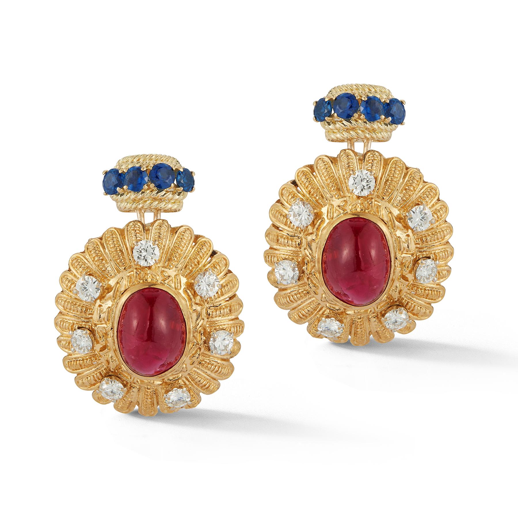 Cabochon Ruby, Sapphire & Diamond Earrings,
Circa 1965. 
2 cabochon rubies surrounded by 14 round diamond and 8 round cut sapphires 

Back Type: screw back 

Gold type: 18k yellow gold

Measurements: 1.5