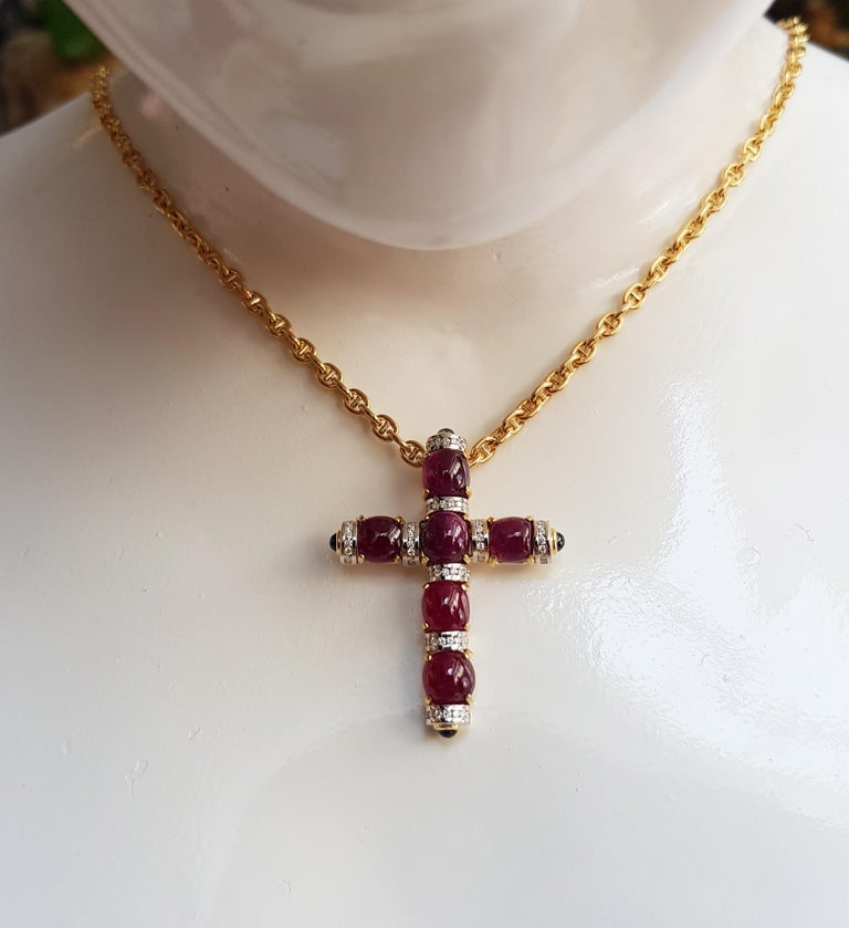 Cabochon Ruby 15.10 carats with Blue Sapphire 0.85 carat and Diamond 0.40 carat Cross Pendant set in 18 Karat Gold Settings
(chain not included)

Width: 3.9 cm
Length: 4.3 cm 

