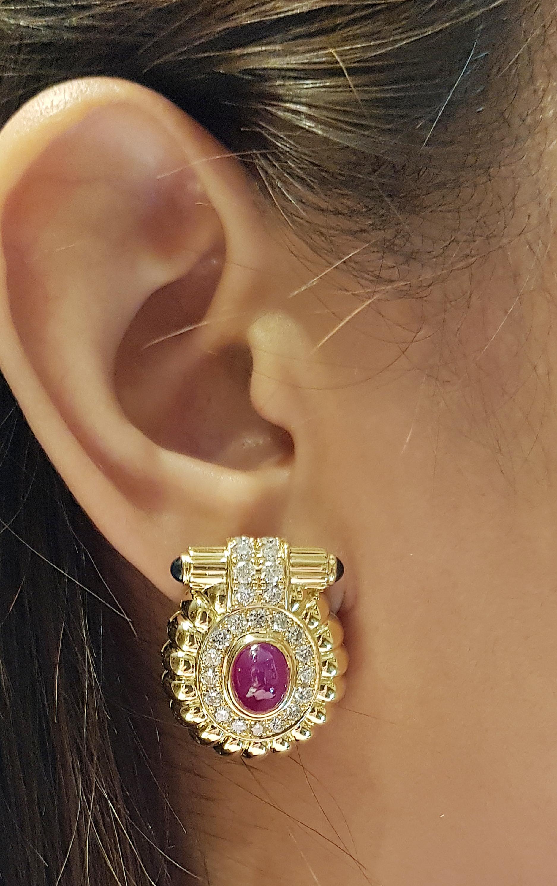 Cabochon Ruby 5.76 carats with Diamond 2.03 carats and Cabochon Blue Sapphire 0.83 carat Earrings set in 18 Karat Gold Settings

Width:  2.3 cm 
Length: 2.7 cm
Total Weight: 23.04 grams

