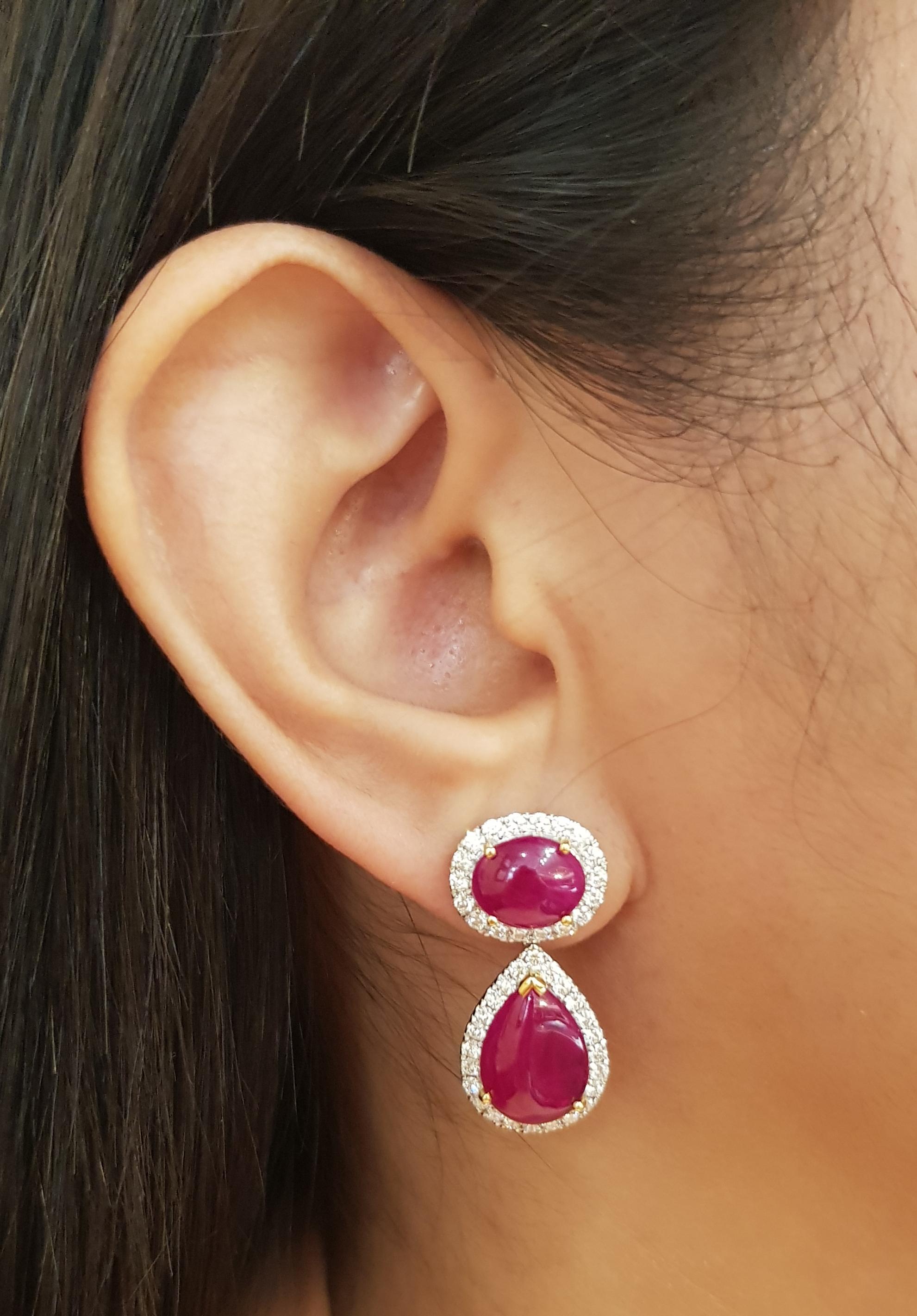 Cabochon Ruby 9.62 carats with Diamond 1.44 carats Earrings set in 18K White Gold Settings

Width: 1.3 cm 
Length: 2.8 cm
Total Weight: 11.37 grams


