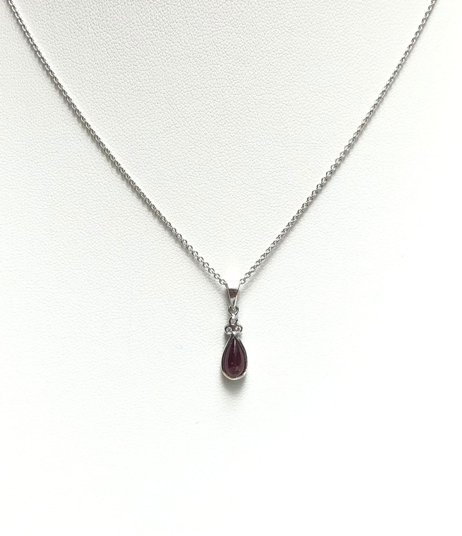 Cabochon Ruby 1.59 carats with Diamond  0.03 carat Pendant set in 18 Karat White Gold Settings
(chain not included)

Width:  0.6 cm 
Length: 2.1 cm
Total Weight: 1.46 grams

