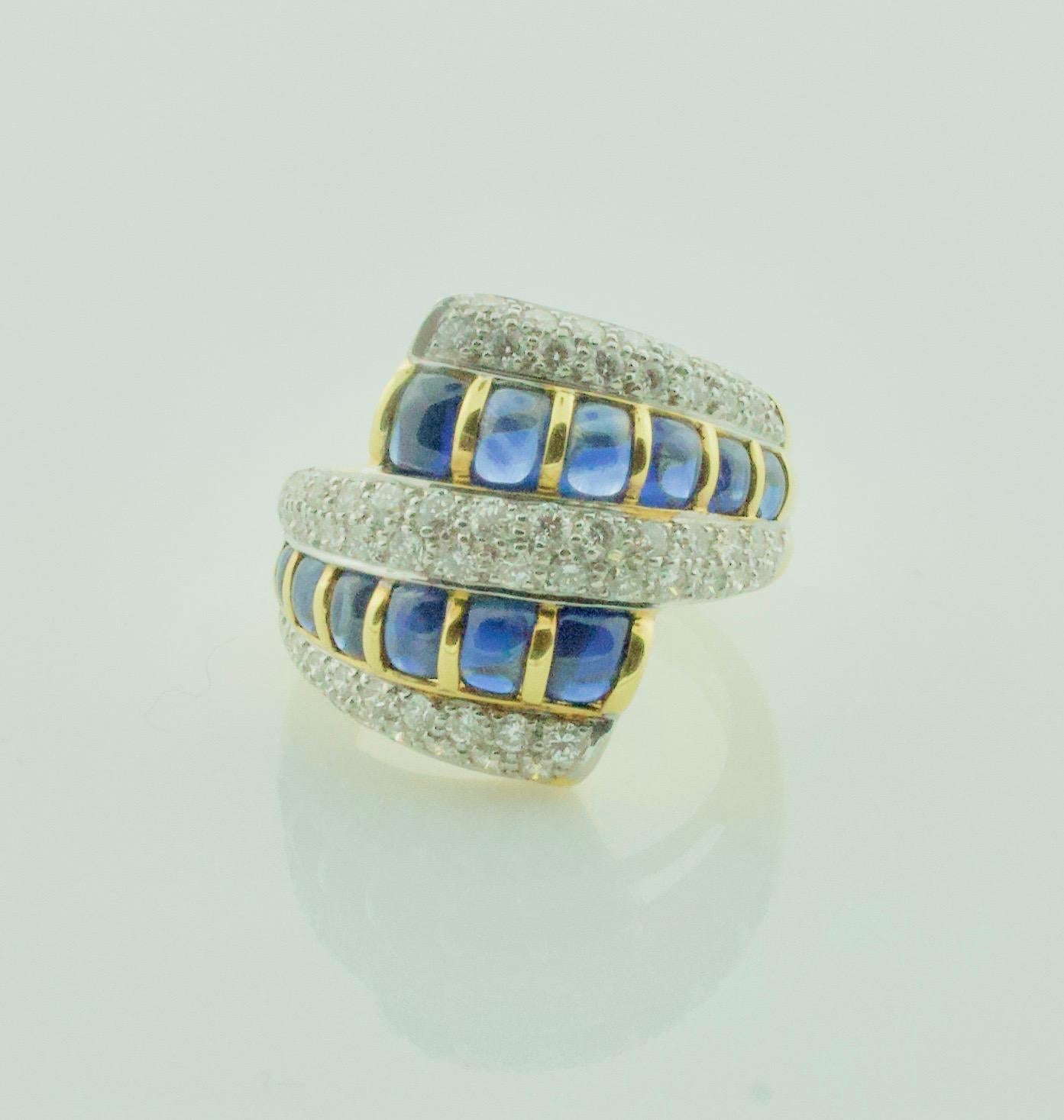 Cabochon Sapphire and Diamond Ring in 18k Yellow Gold
Twelve Cabochon Sapphires  Weighing 1.90 Carats Approximately [bright with no imperfections visible to the naked eye]
Sixty Two Round Brilliant Cut Diamonds Weighing 1.40 Carats Approximately