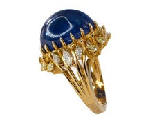Cabochon Sapphire and Fancy Yellow Diamond Halo Cluster Ring