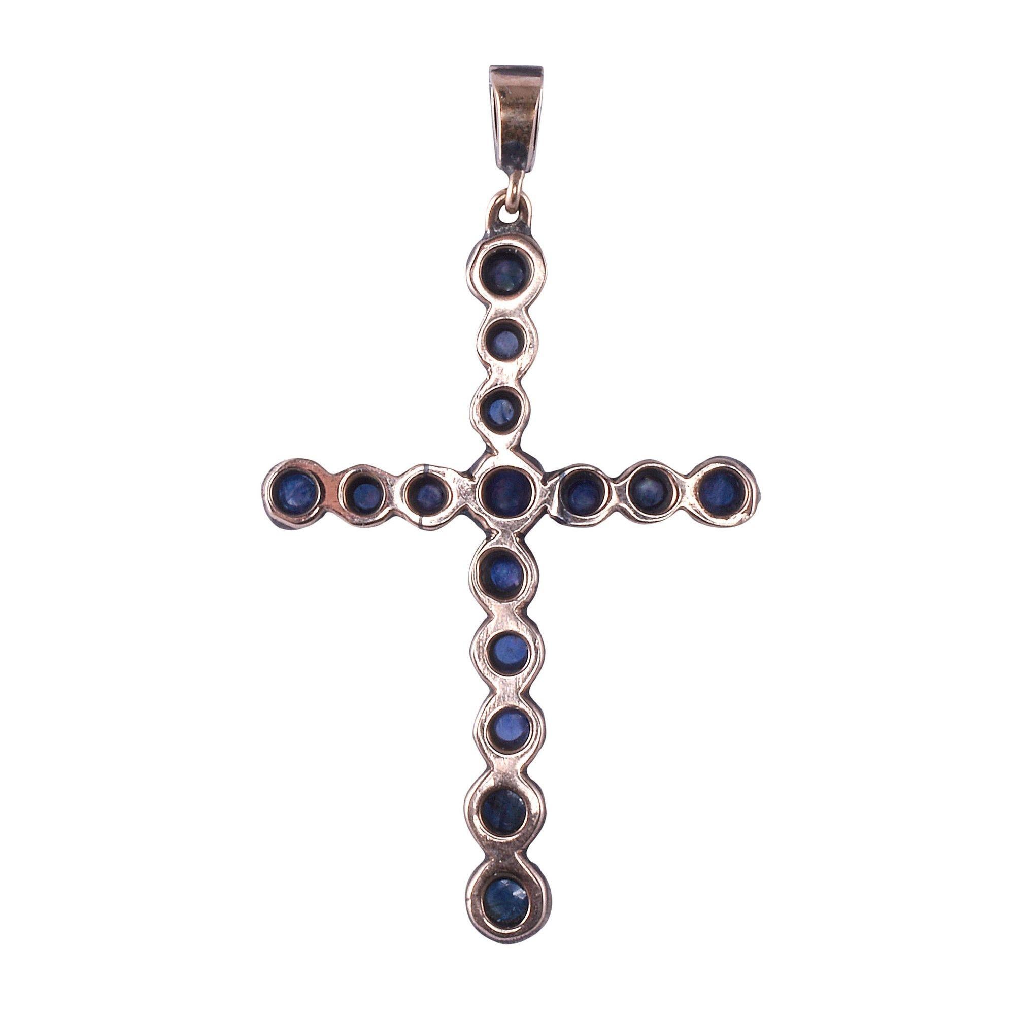 Antique English cabochon sapphire cross pendant, circa 1900. This antique cross pendant is crafted in 9 karat rose gold and sterling silver. The Victorian cross features cabochon sapphires of varying size. There are also three rose cut diamonds in