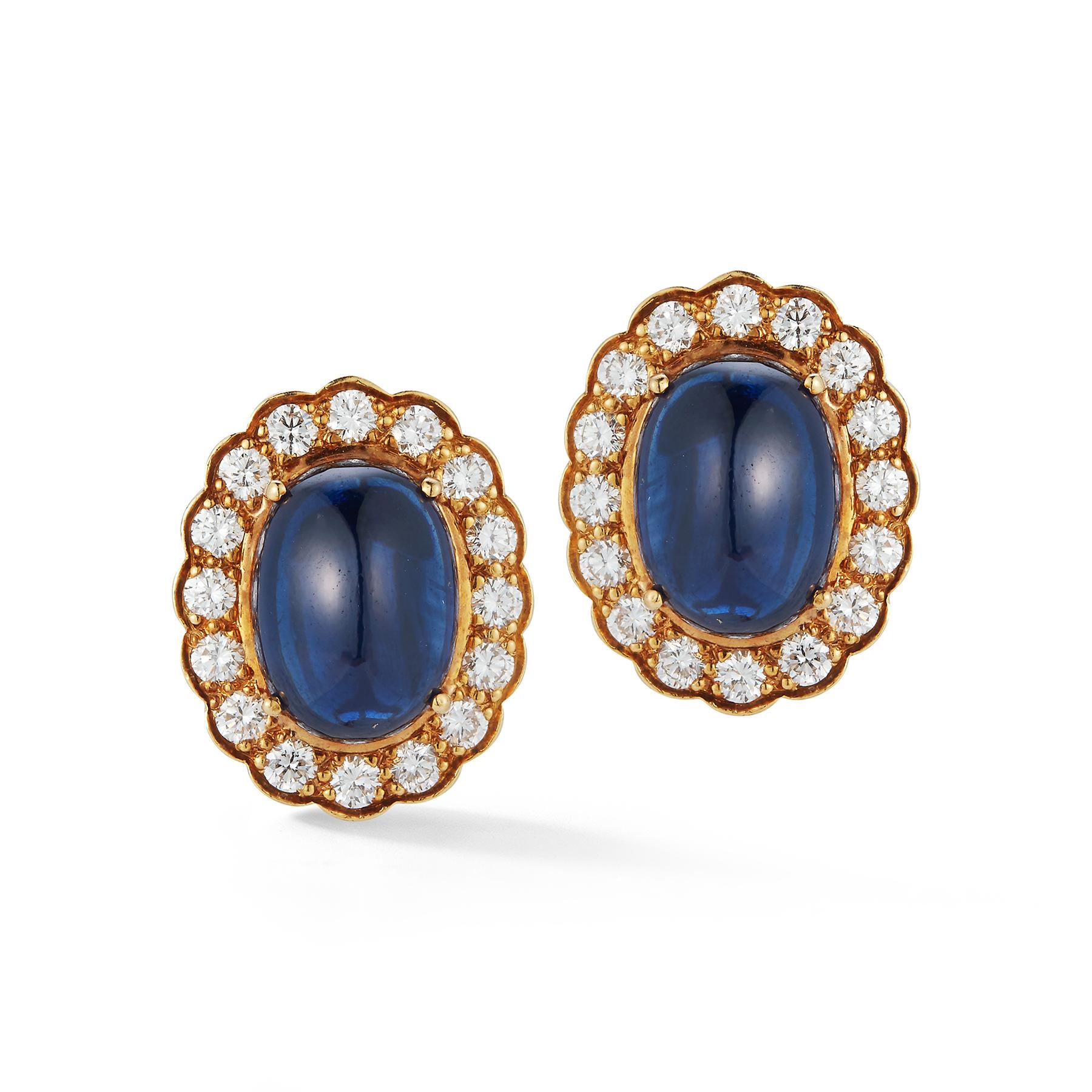 Cabochon Sapphire & Diamond Halo Earrings

 2 cabochon sapphires approximately 18.00 cts.  32 round diamonds approximately 2.00 cts 
18 karat yellow gold
Measurements: .78