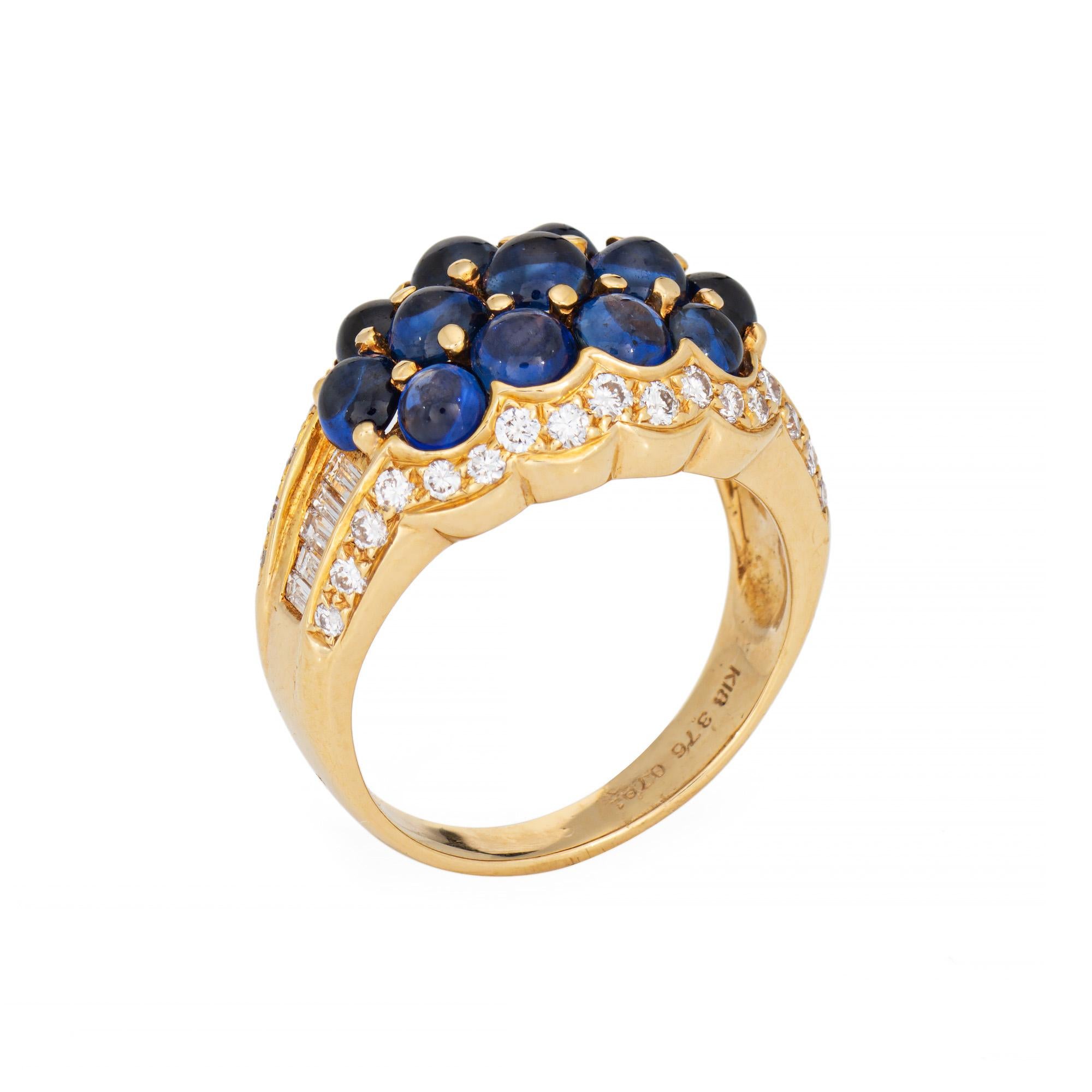 Stylish cabochon sapphire & diamond ring crafted in 18 karat yellow gold. 

Cabochon sapphires total an estimated 3.76 carats. Diamonds total an estimated 0.79 carats (estimated at I-J color and VS2-SI2 clarity).  

Cabochon cut sapphires capture a