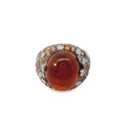 Bague en or 18 carats avec grenat spessartite cabochon, diamant et saphir orange