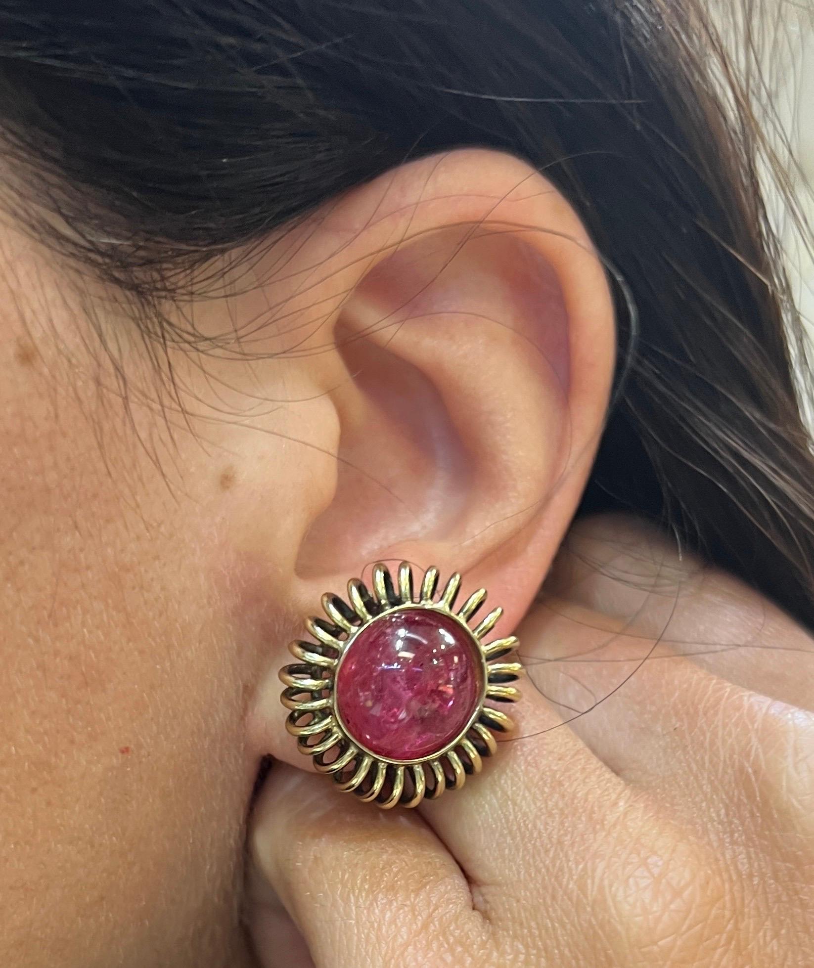 Cabochon Spinel Earrings

 A pair of earrings with two cabochon red spinels set in 14 karat yellow gold setting.

Measurements: .75