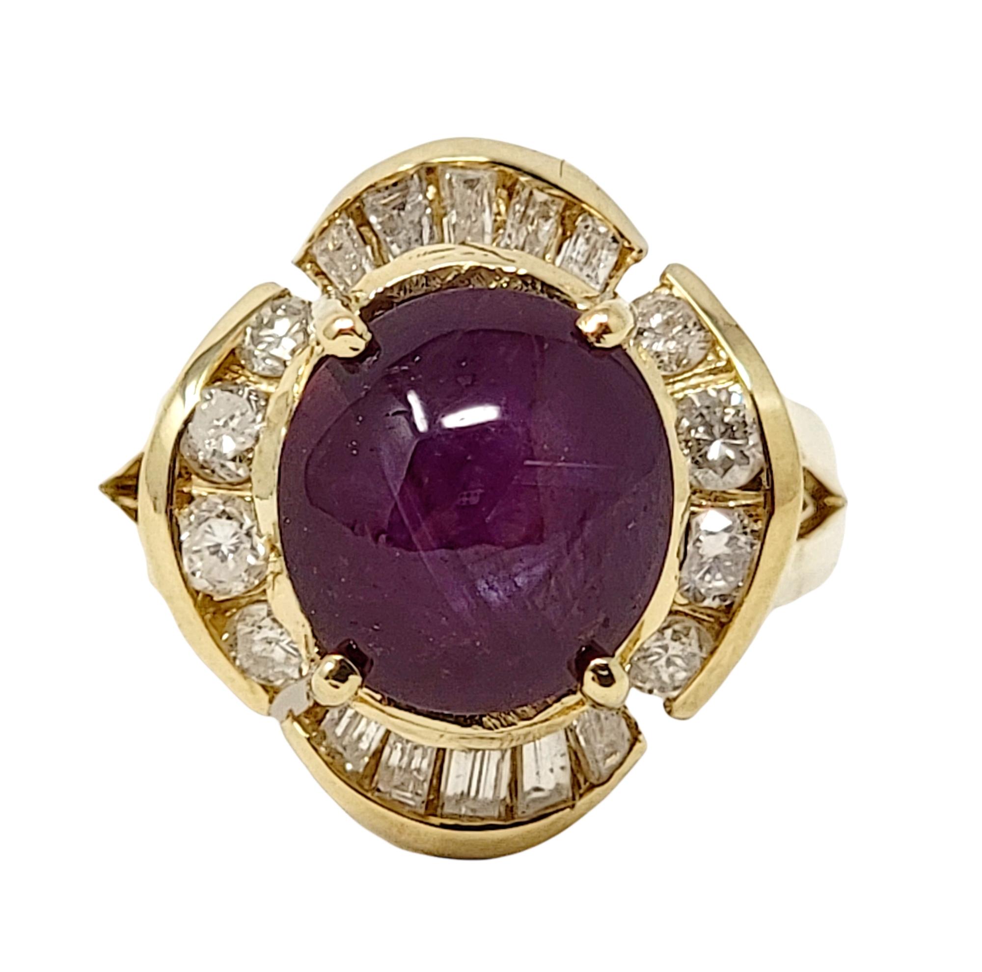 Ring size: 6

Stunning and unique star ruby and diamond cocktail ring. This gorgeous piece features a single 9.08 carat oval cabochon star ruby stone prong set at the center of the piece. Surrounding the incredible purplish-red stone is a curved
