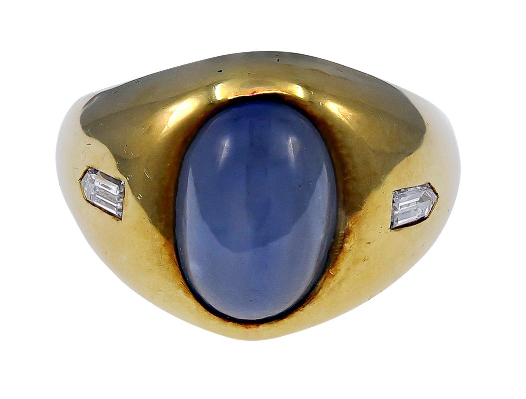 A striking cabochon Star Sapphire Ring with 2 bullet diamonds. This ring is absolutely gorgeous.

