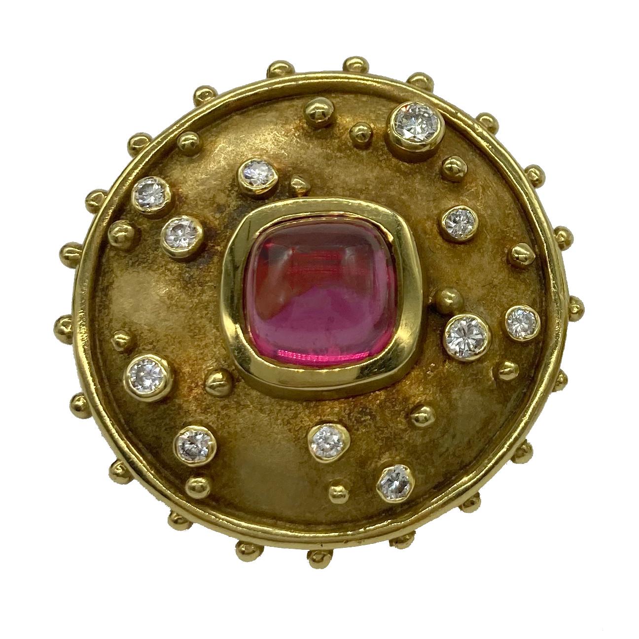 A chic pair of 18 karat yellow gold earclips centering cabochon tourmalines and embellished with diamonds.