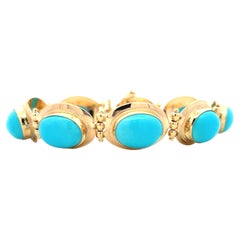 Bracciale a maglie in turchese sintetico cabochon e oro giallo 18k