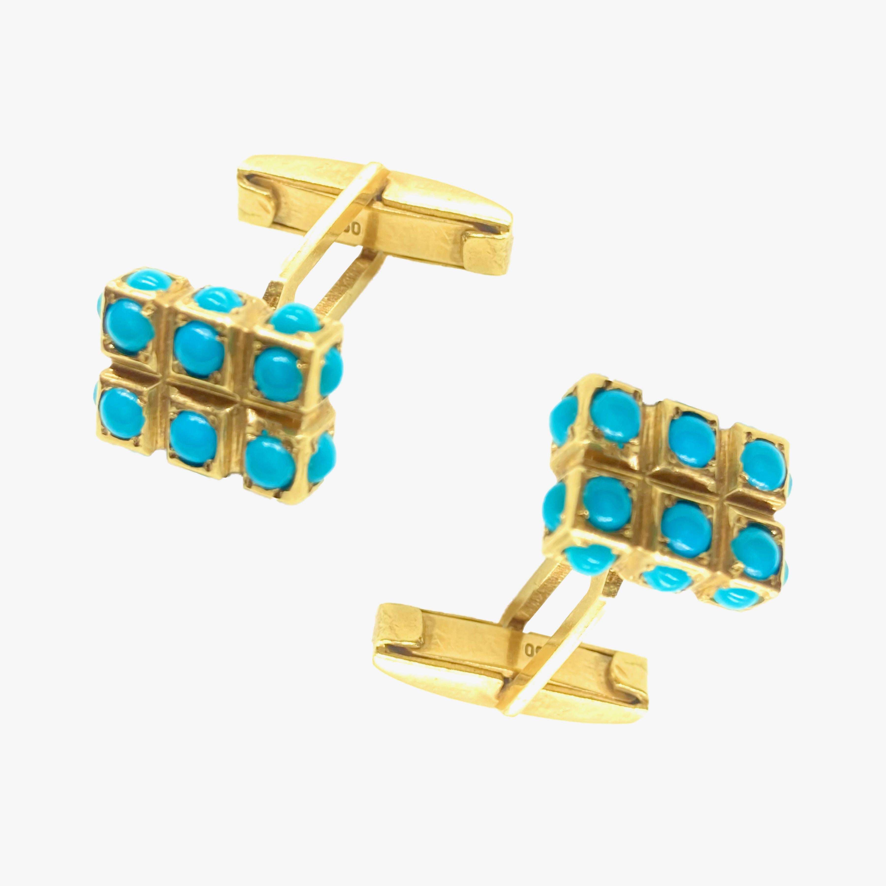A chic pair of vintage yellow gold cufflinks decorated with cabochon turquoise. Circa 1970.